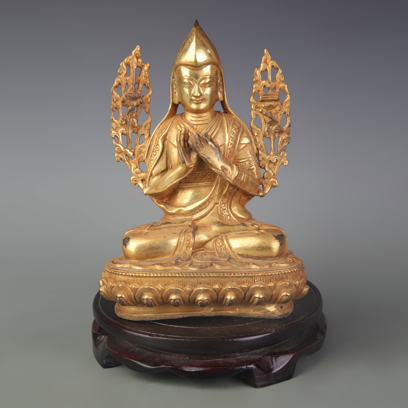 A GILT BRONZE TSONGKHAPA FIGURE: Qing Dynasty; Width: 5.5 inch; High: 8.0 inch; Wooden base for diplay only