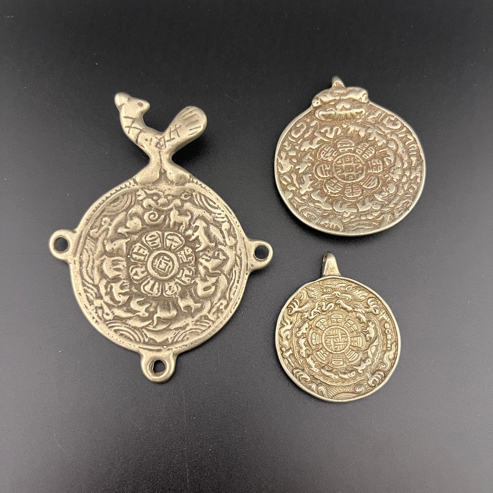 GROUP OF TIBETAN SIPAHO AMULET, NINE-PALACE BAGUA TALISMAN
