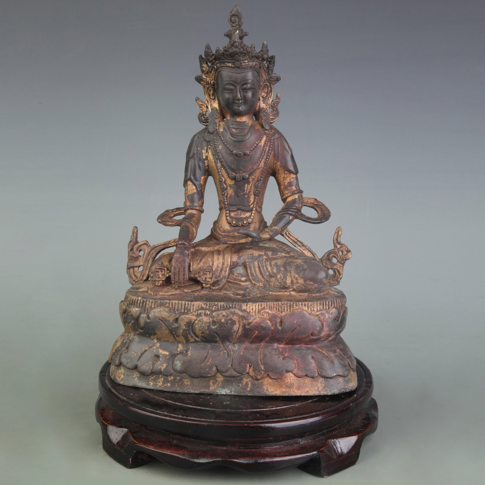 A FINE GILT BRONZE TIBETAN GREEN TARA STATUE: Qing Dynasty; High: 9.0 inch; Wooden base for diplay only