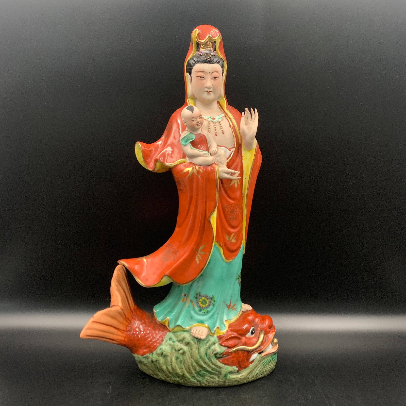 FAMILLE ROSE PORCELAIN CHILD-GIVING GUANYIN STATUE