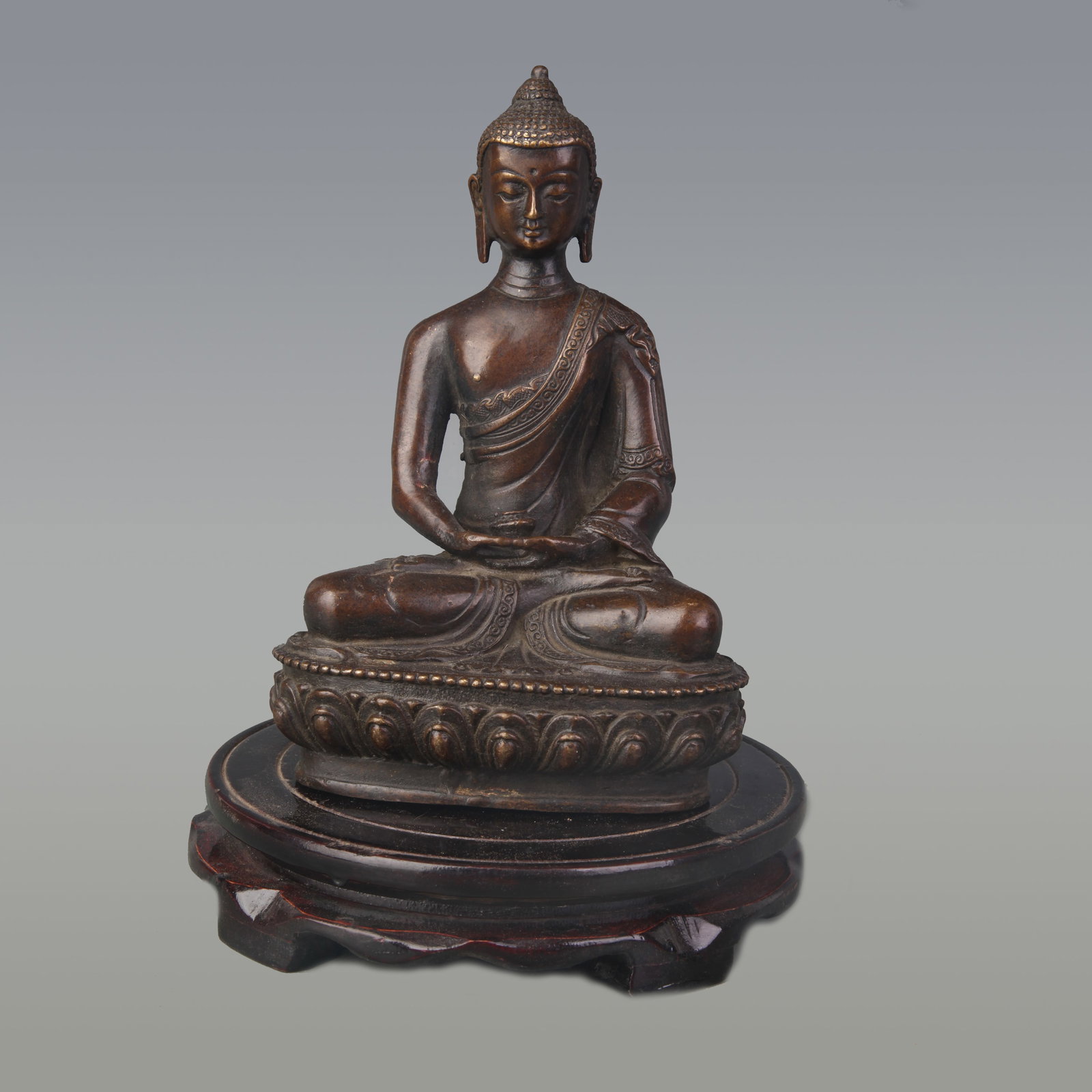 A FINE BRONZE MEDICINE BUDDHA FIGURE: Qing Dynasty; High: 7.9 inch; Wooden base for diplay only