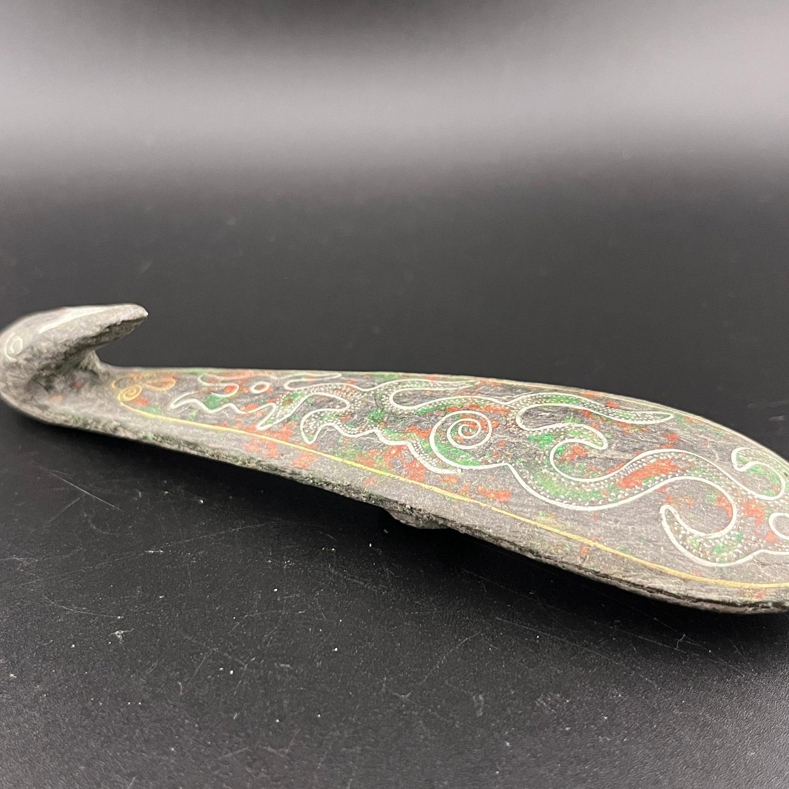 A FINE SILVER INLAYED BRONZE GARMENT HOOK