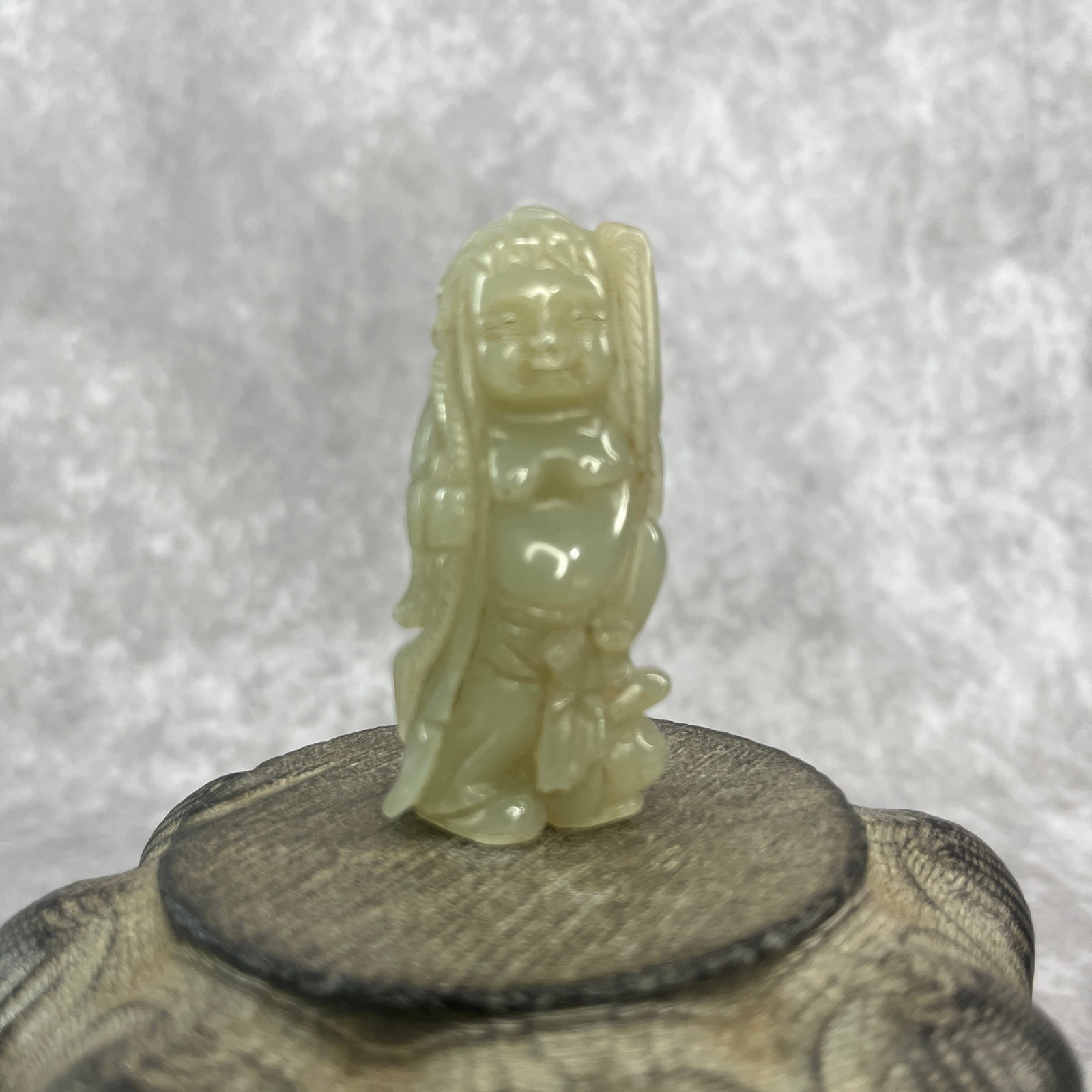 FINE HAND-CARVED JADE FIGURINE OF A STANDING DEITY: Qing Dynasty; Long: 2.5 inch; Width: 1.18 inch; High: 0.68 inch