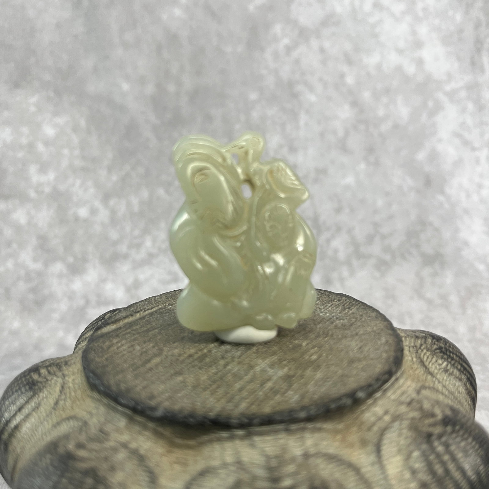 FINE HAND-CARVED JADE FIGURINE OF OLD MAN WITH BIRD: Qing Dynasty; Long: 1.73 inch; Width: 1.3 inch; High: 0.4 inch
