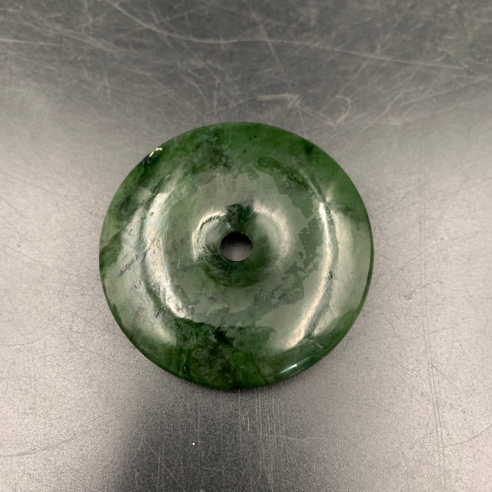 GREEN JADEITE "PING AN KOU" (SAFETY DONUT) DISC PENDANT: Modern; Long: 2.1 inch; Width: 2.1 inch; High: 0.3 inch; Diameter: 2.1 inch