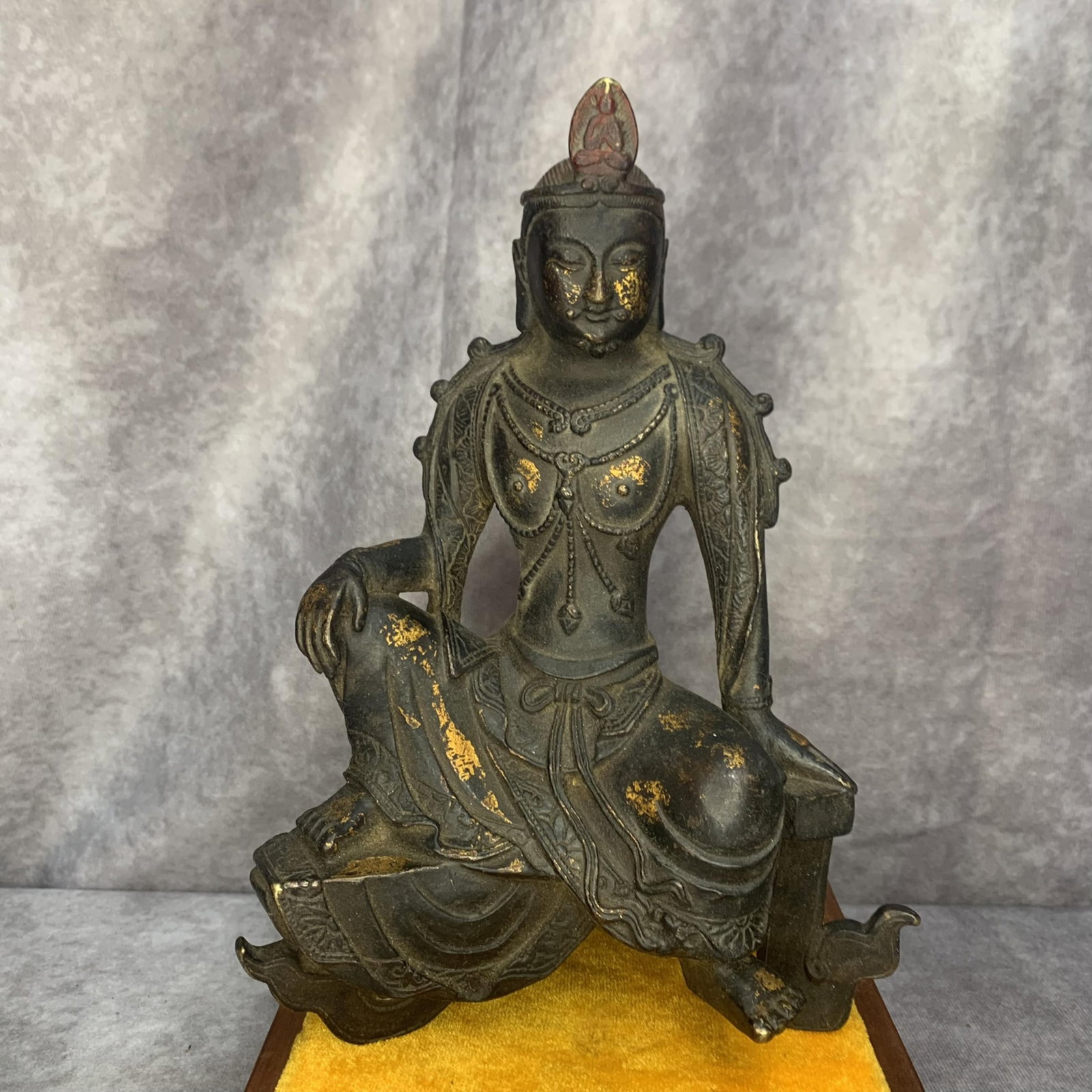 A FINE BRONZE WATER-MOON GUANYIN (SHUIYUE GUANYIN): Qing Dynasty; High: 9.0 inch; Width: 6.0 inch; Long: 5.5 inch; Wooden base for diplay only