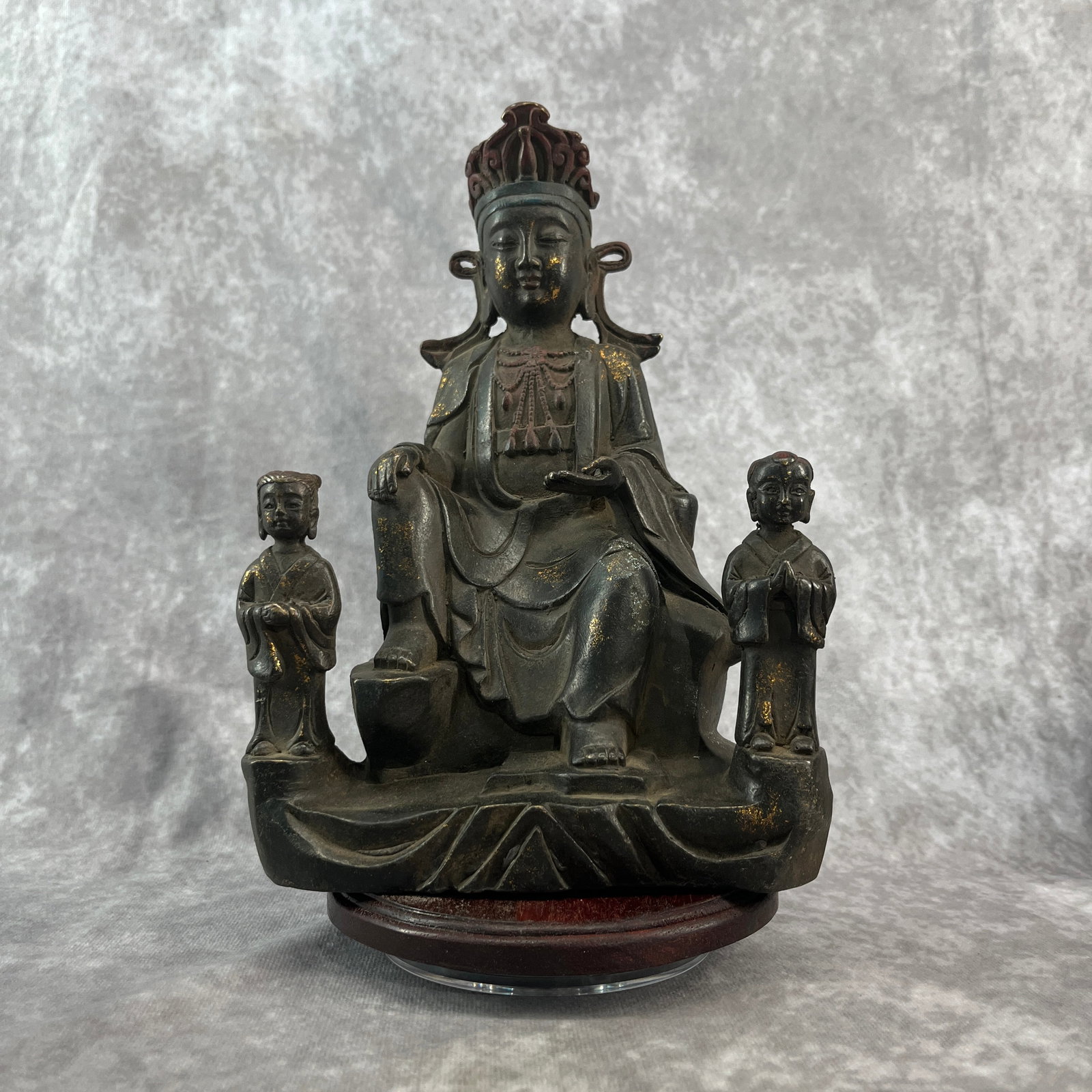 A FINE BRONZE GUANYIN WITH SHANCAI AND LONGNU STATUE: 20th Century; Long: 6.4 inch; Width: 3.6 inch; High: 9.3 inch; Wooden base for diplay only