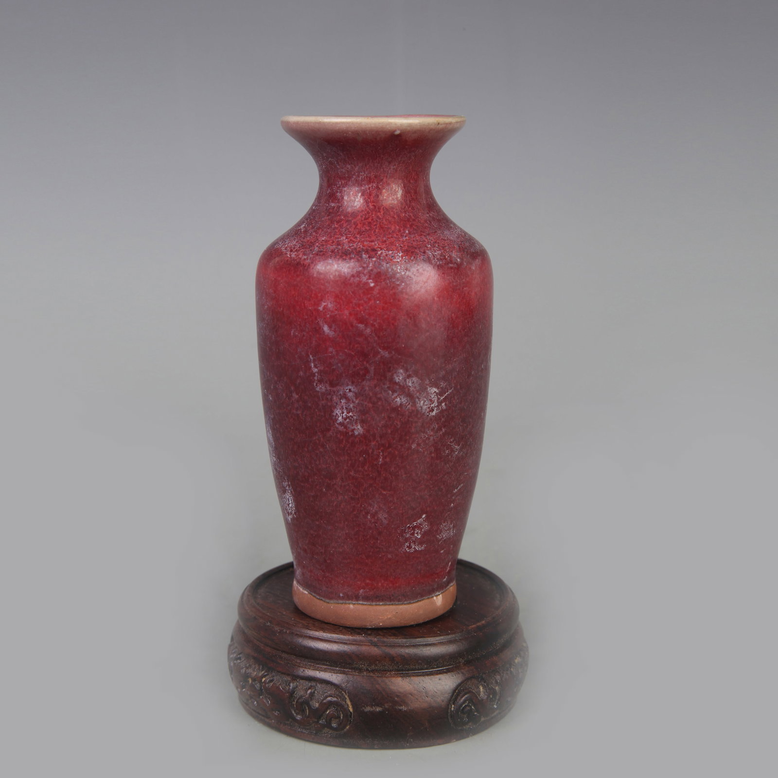 A FINE MONOCHROME COPPER-RED GLAZED GUANYIN VASE