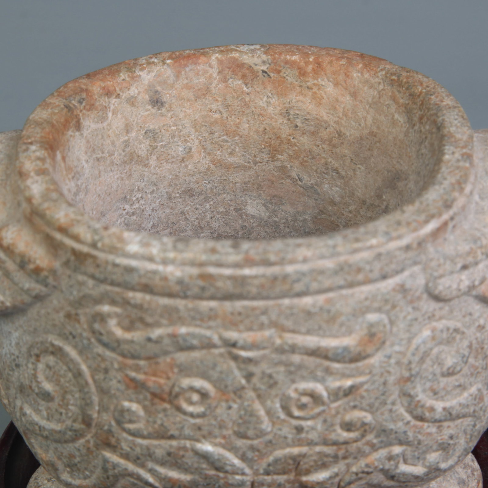 A FOUR-LEGGED BEAST-HANDLED STONE INCENSE BURNER