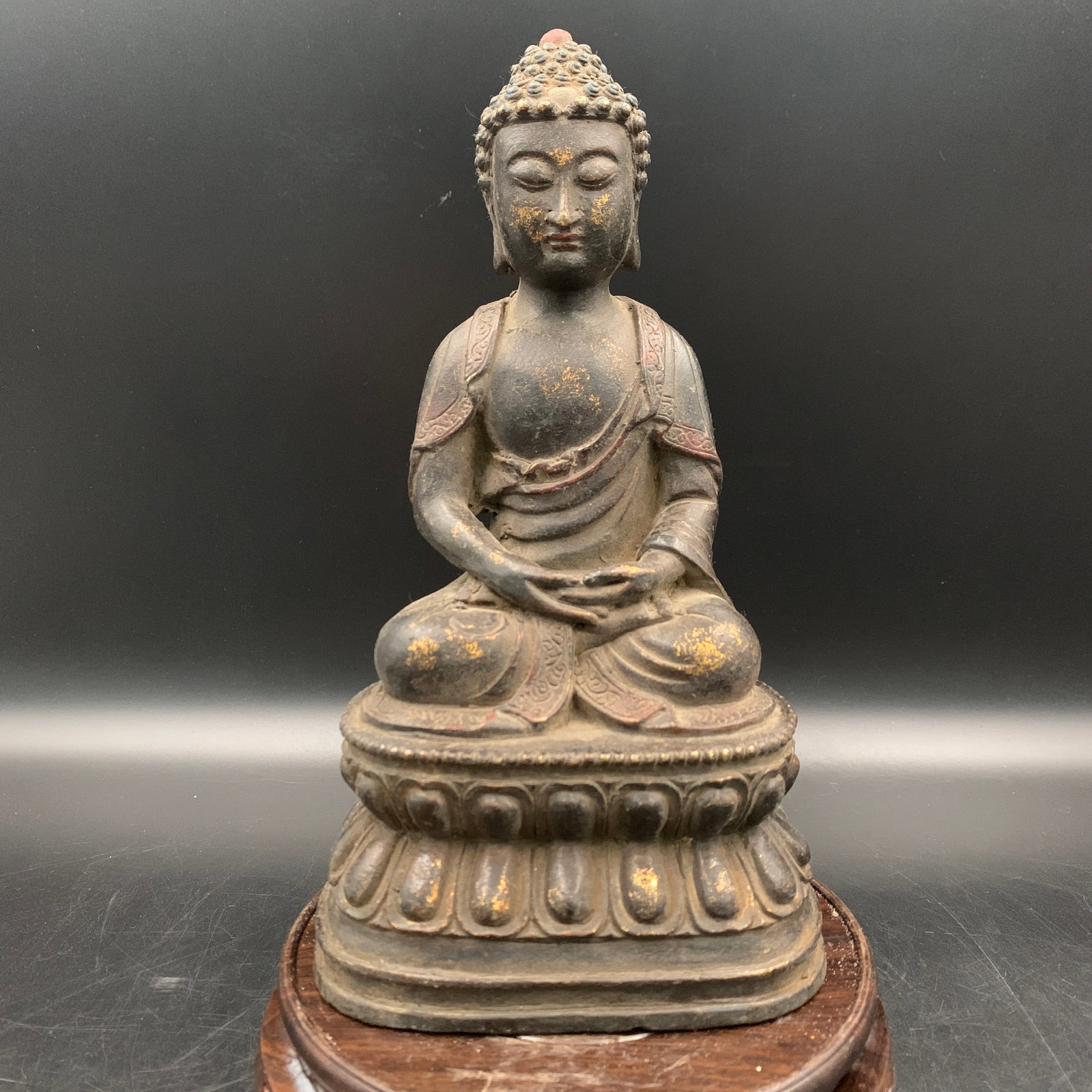 A FINE GILT-BRONZE AMITABHA BUDDHA: Qing Dynasty; Long: 5.1 inch; Width: 4 inch; High: 9.3 inch; Wooden base for diplay only