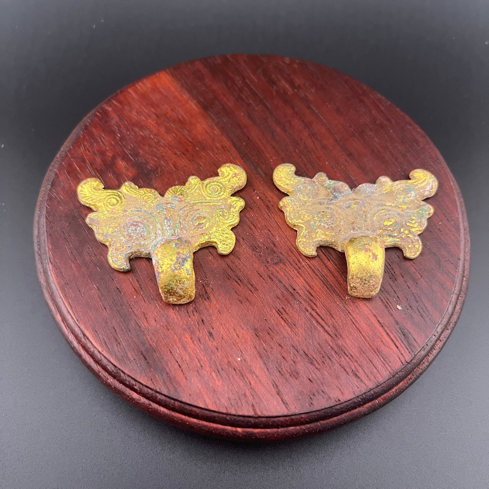 PAIR OF GILT BRONZE TAOTIE FIGURE BELT BUCKLE: Long: 1.9 inch; Width: 1.7 inch; High: 0.4 inch; Wooden base for diplay only