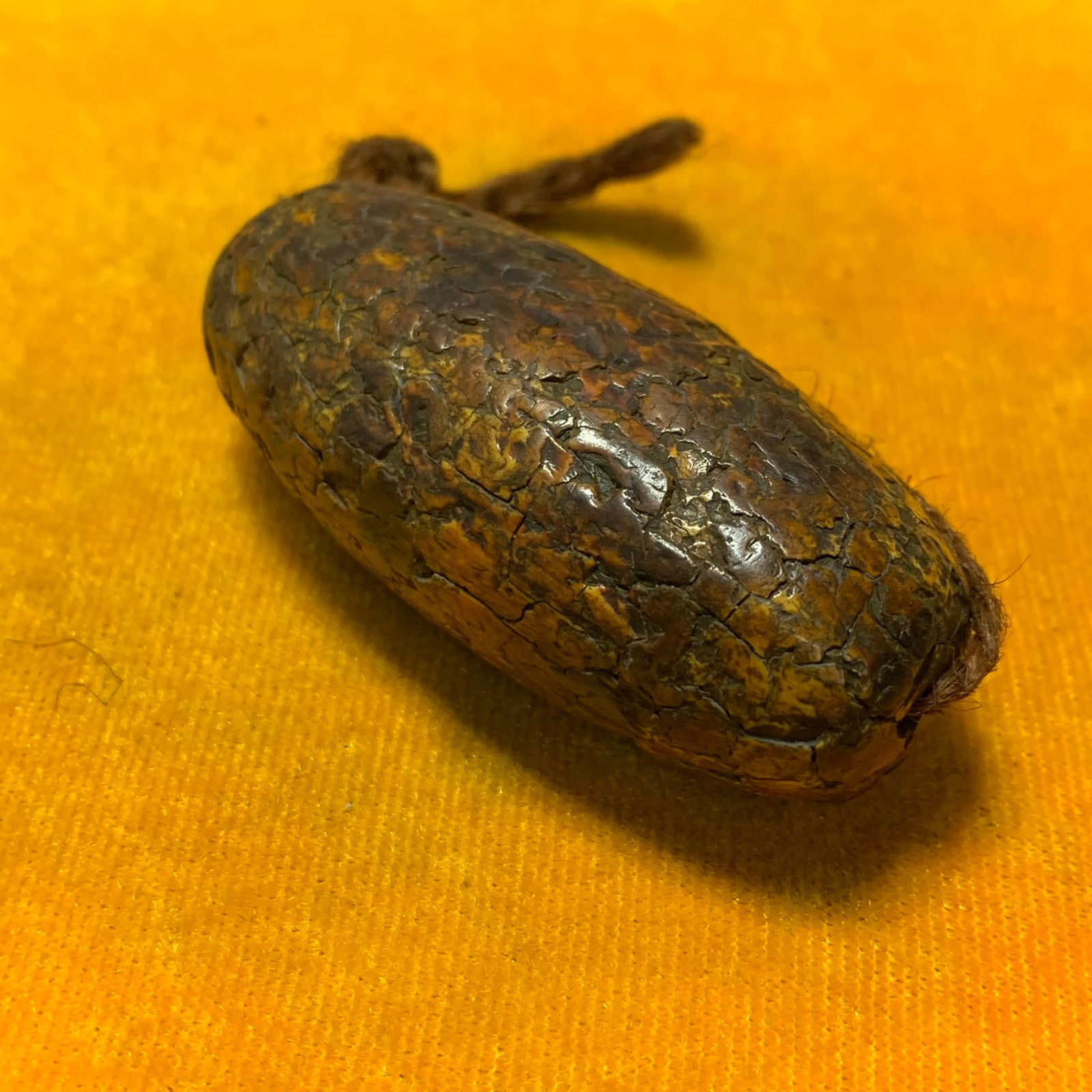 A CARVED BONE HANDHELD ORNAMENT, MING DYNASTY: Ming Dynasty Style; Long: 1.1 inch; Width: 1.1 inch; High: 2.5 inch; Wooden base for diplay only