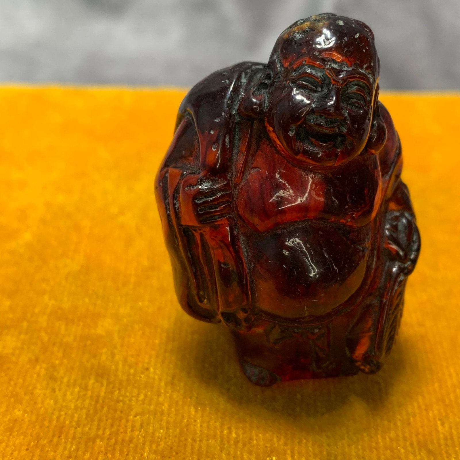 A FINE AMBER MADE PENDANT OF LAUGHING BUDDHA: Ming Dynasty Style; Long: 1.4 inch; Width: 1.3 inch; High: 2.1 inch; Wooden base for diplay only