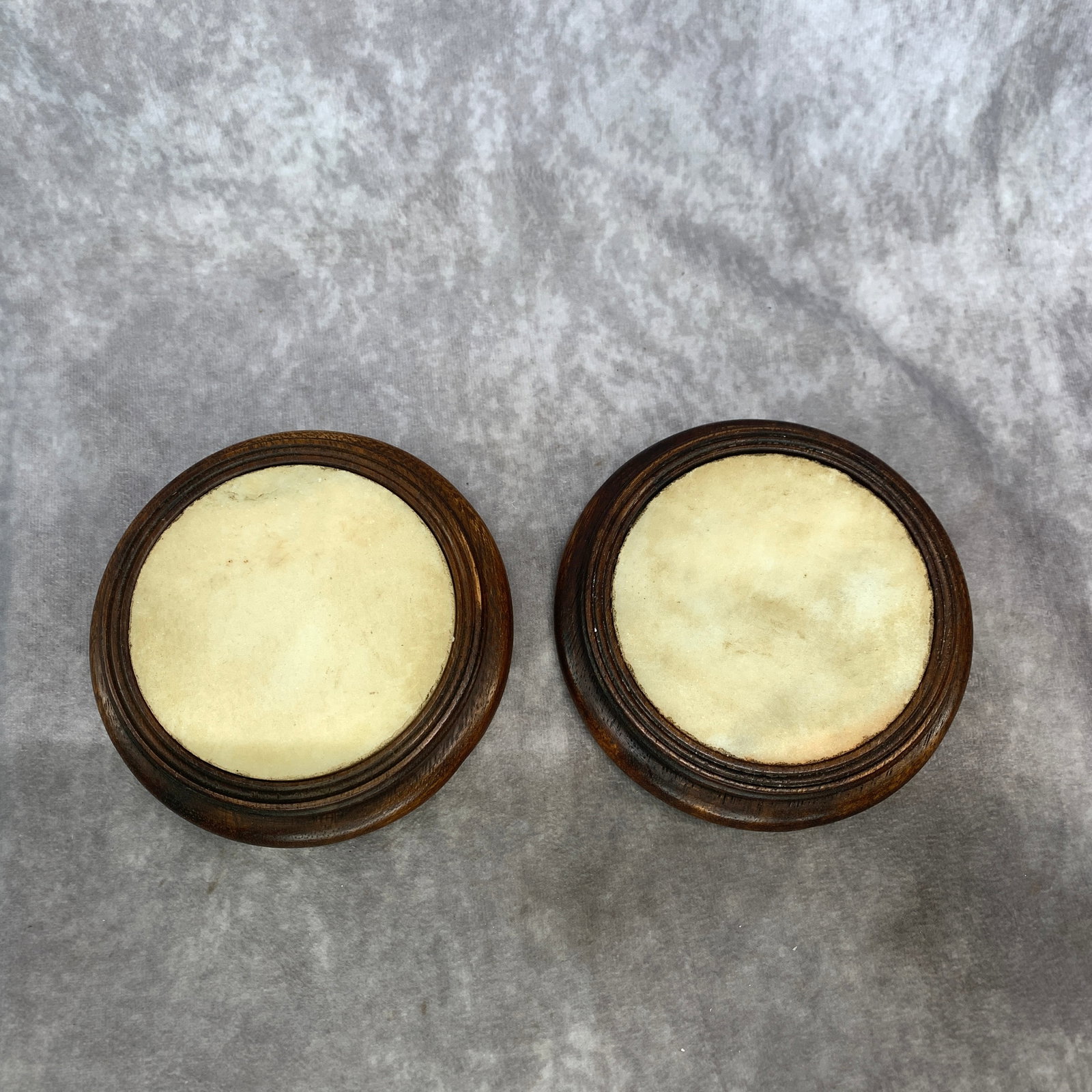 PAIR OF ROUND WHITE MARBLE INSET WOODEN BASE: Modern; High: 1.1 inch; Diameter: 5.4 inch