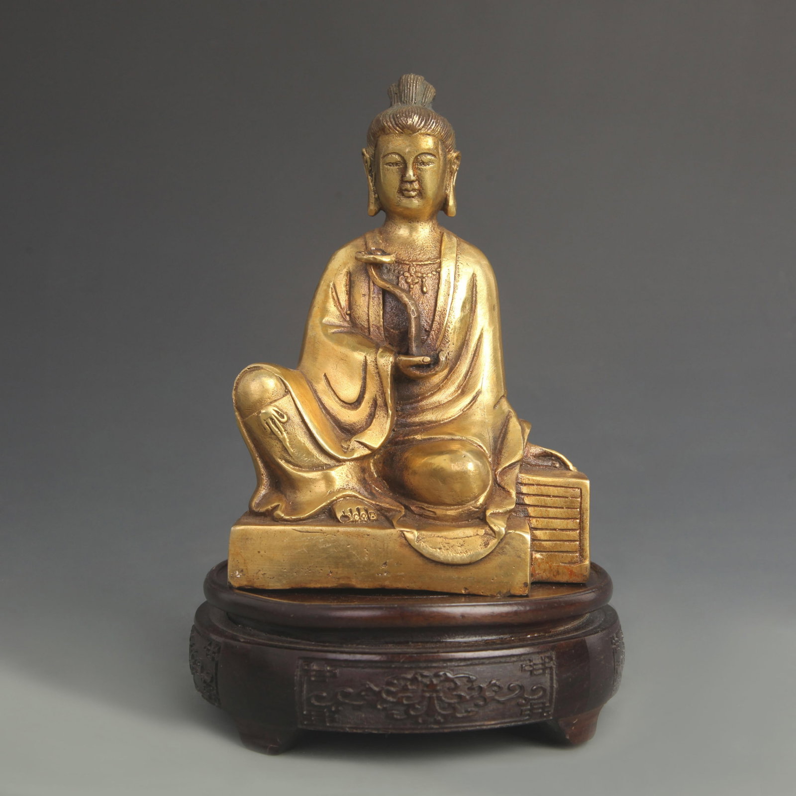 BRONZE FIGURE OF GUANYIN HOLDING RUYI SCEPTER: 20th Century; High: 6.75 inch; Width: 4.25 inch; Wooden base for diplay only