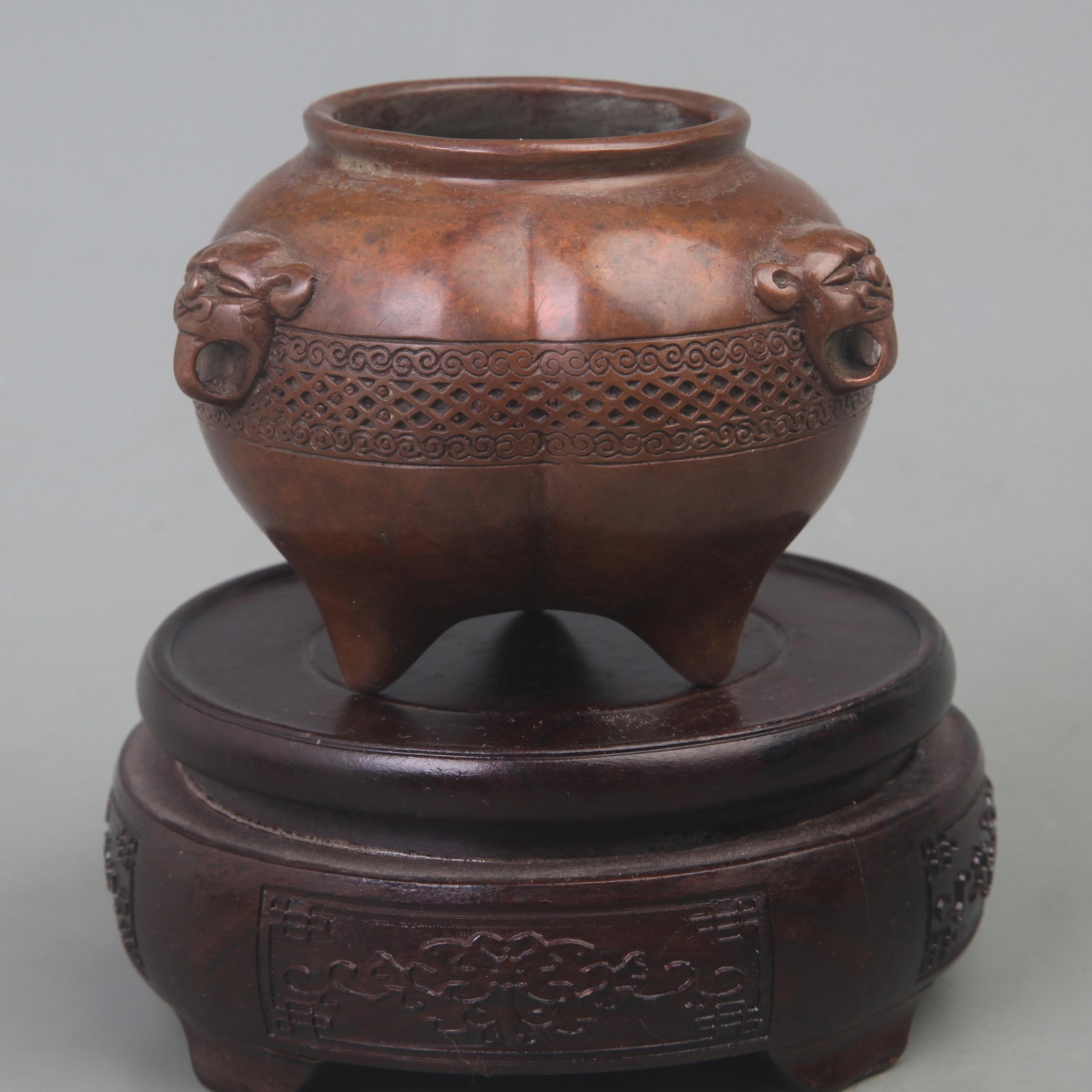A FINE BRONZE ANIMAL EAR ROUND BRONZE CENSER: Ming Dynasty Style; Diameter: 3.5 inch; High: 3 inch; . Wooden base for display only