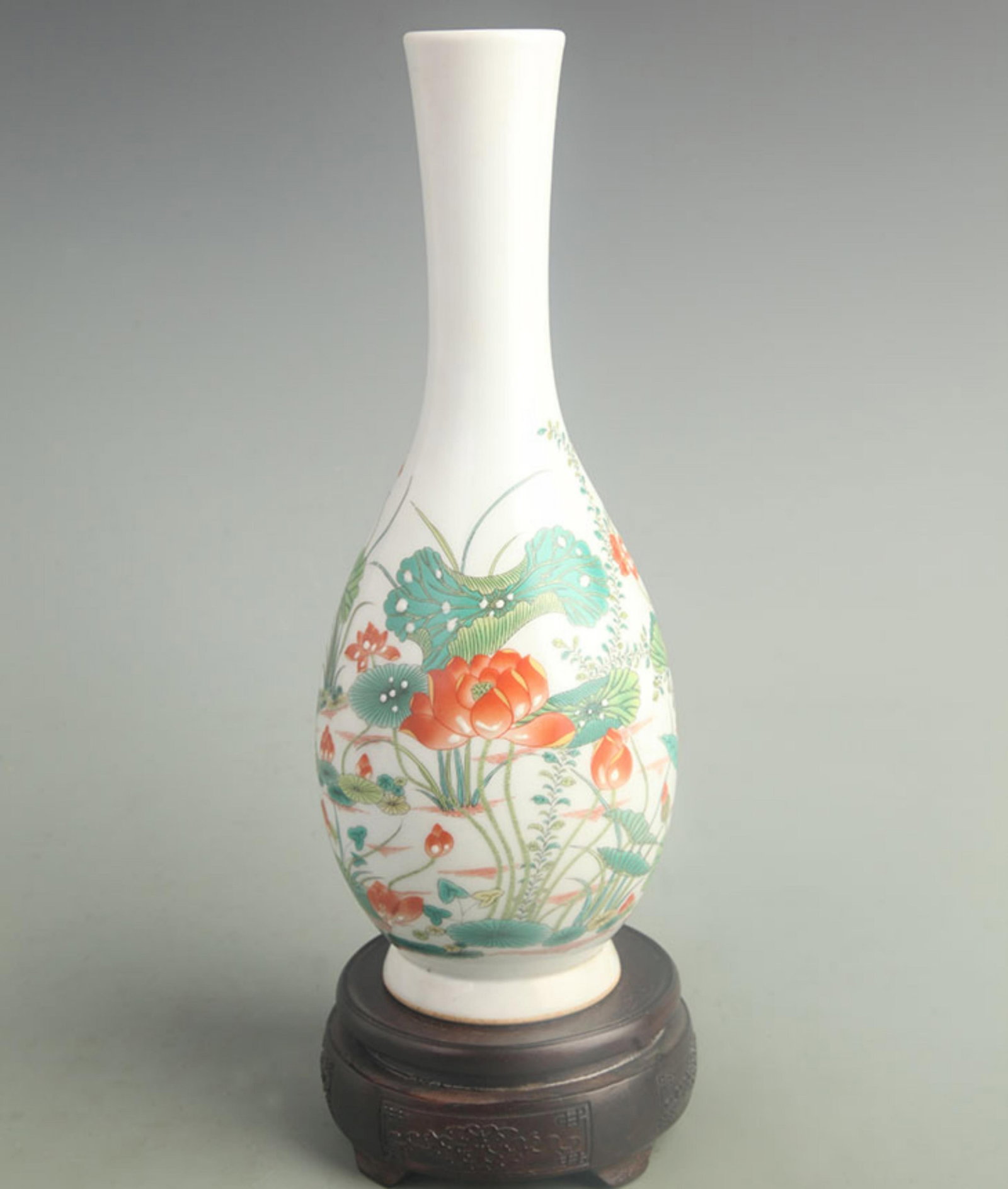 FAMILLE ROSE PORCELAIN VASE WITH LOTUS AND GUANYIN MOTIF: Qing Dynasty Qianlong Period; High: 11.2 inch; Width: 4.20 inch; . Wooden base for display only