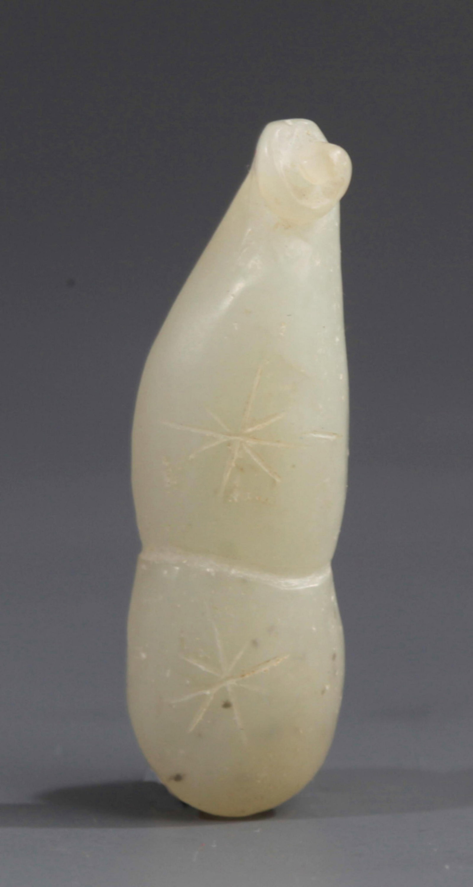 A FINE CALABASH SHAPED PALE CELADON JADE PENDANT: Modern; Long: 1.49 inch; . Wooden base for display only