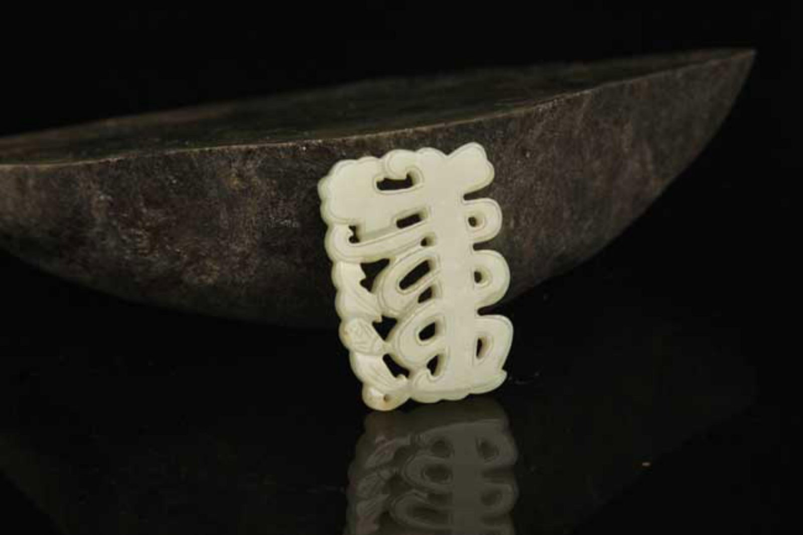 A FINE HOLLOW CARVED HETIAN JADE PENDANT: Modern; High: 1.8 inch High: 1.2 inch . Wooden base for display only