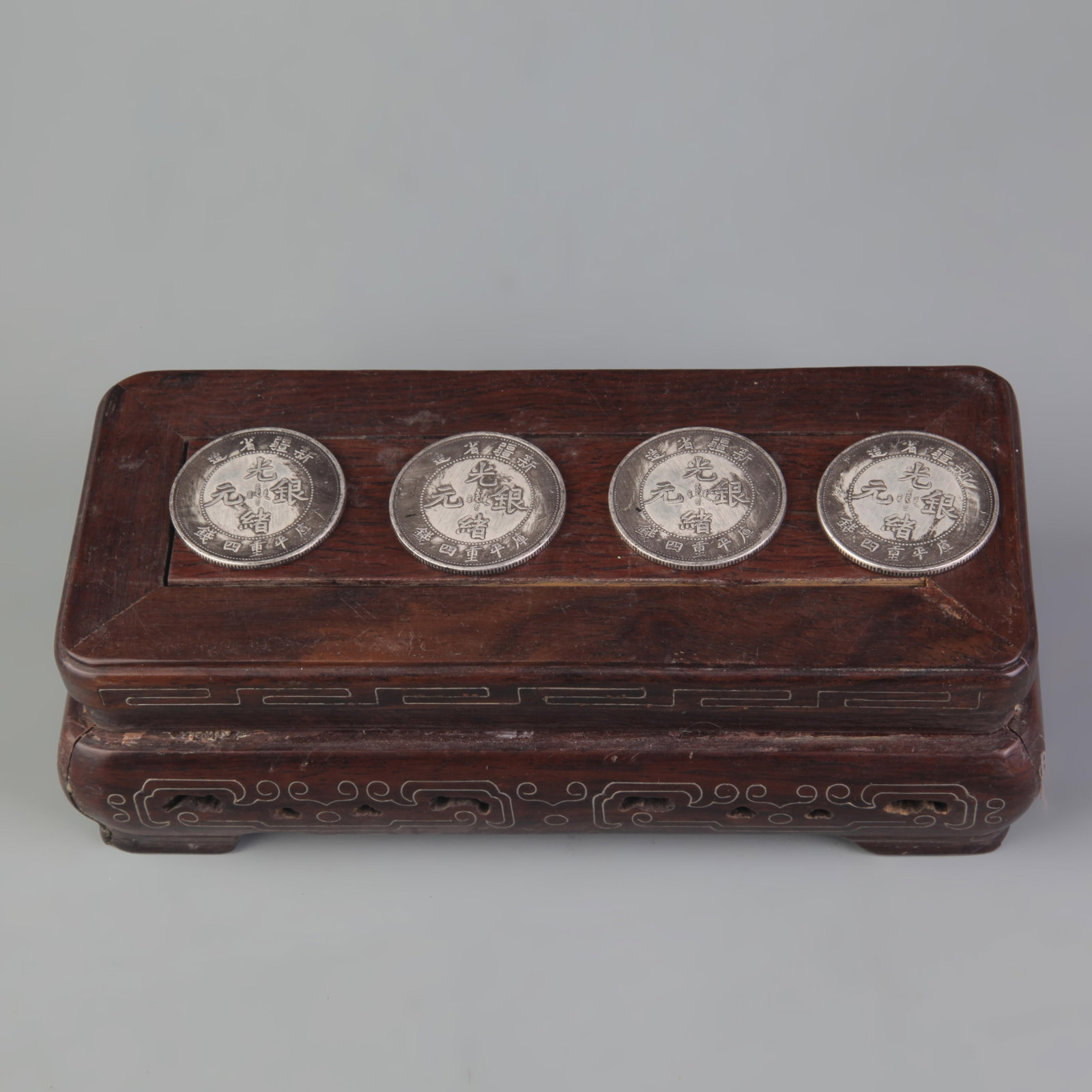 GROUP OF FOUR OLD CHINESE COIN: 19th Century; Diameter: 1.3 inch. Wooden base for display only