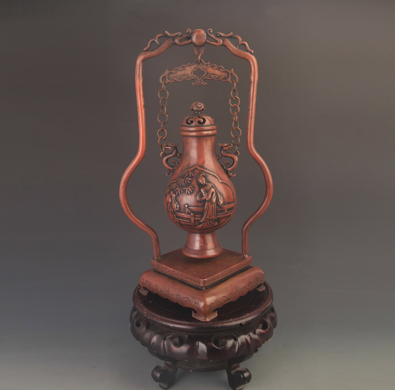 RARE FINELY MADE BRONZE CARVING HANGING VASE: 19th Century; High: 15.5 inch; Width: 9.0 inch; Diameter: 2.0 inch; . Wooden base for display only