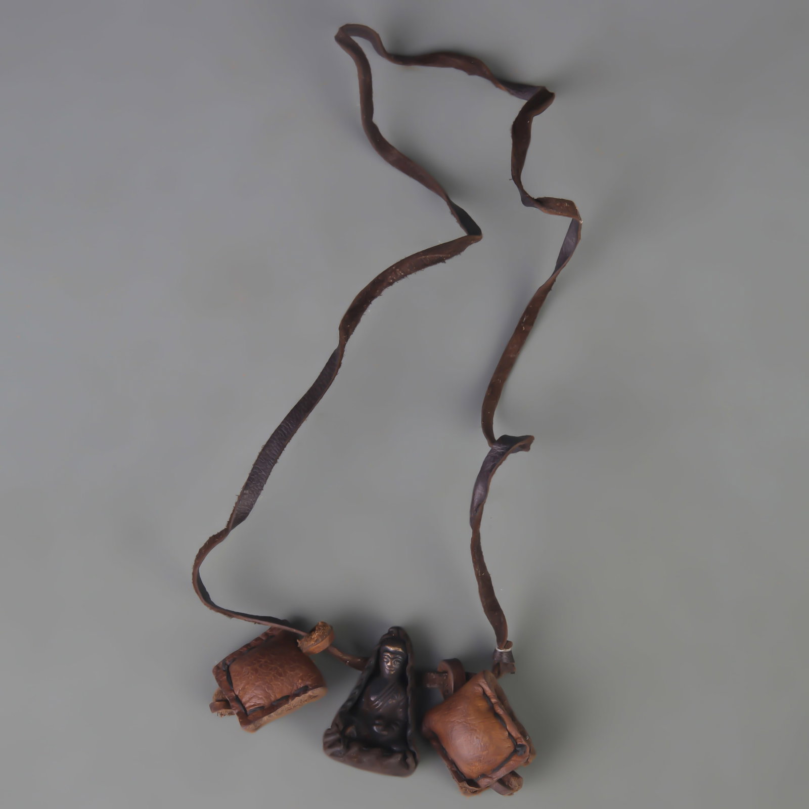 A SMALL TIBETAN BUDDHIST GAU BOX: Qing Dynasty; Long: 1.5 inch; Width: 1.0 inch. Wooden base for display only