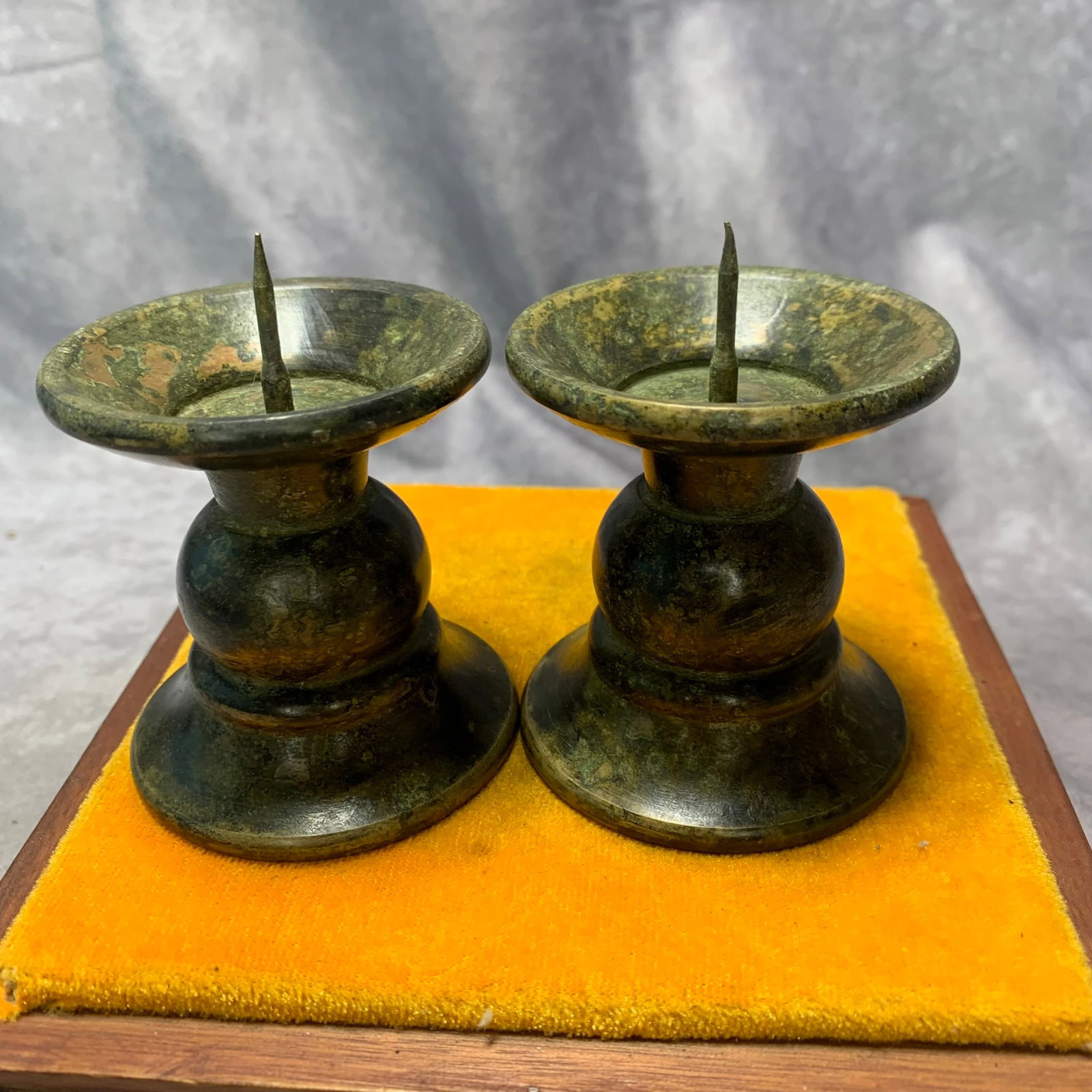 REPUBLIC OF CHINA BRONZE CANDLESTICKS (1 PAIR): Republic Period; High: 3.2 inch; Diameter: 2.6 inch. Wooden base for display only