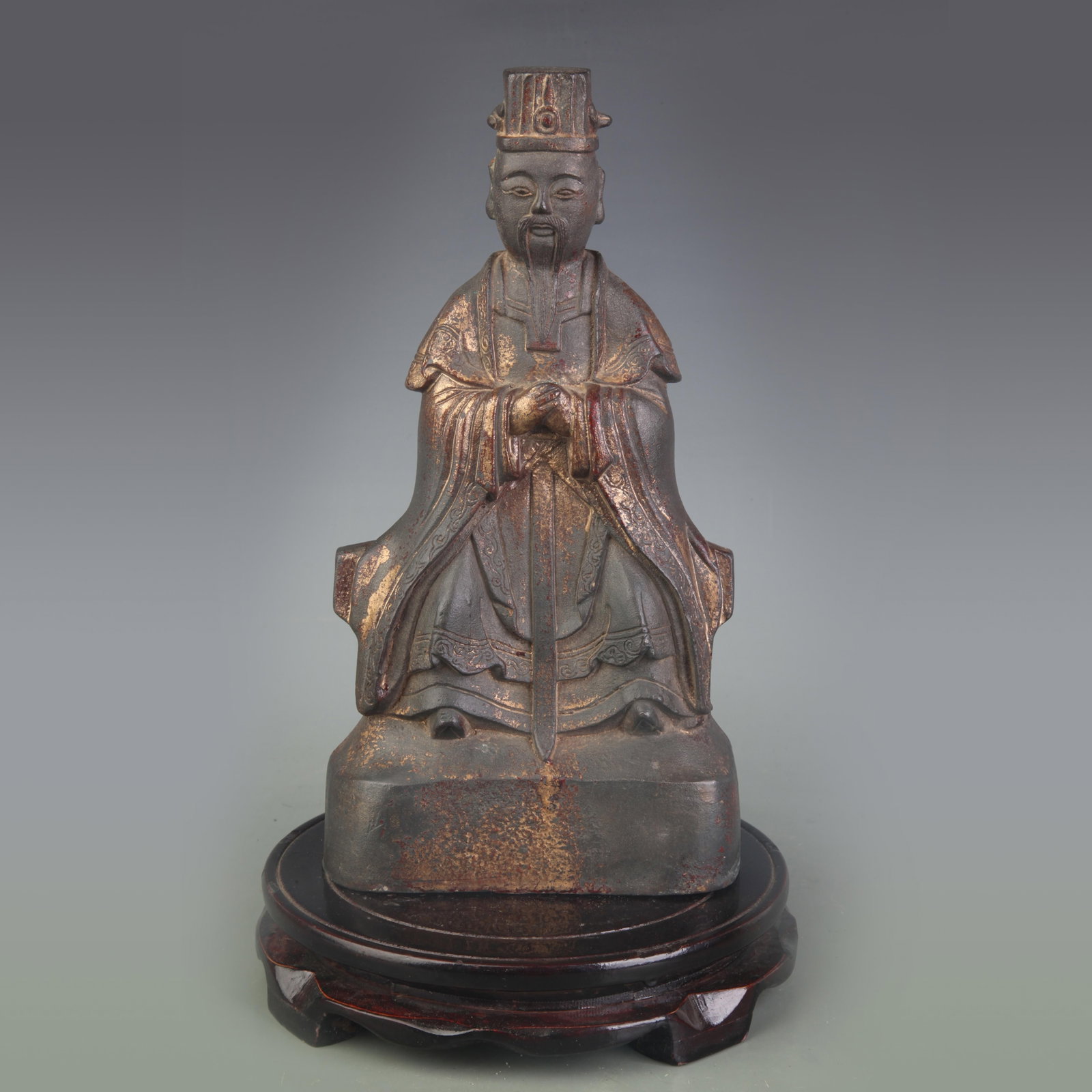 PARTIAL-GILT BRONZE STATUE OF A SEATED TAOIST DEITY: Qing Dynasty; Width: 5.5 inch; High: 10.2 inch. Wooden base for display only