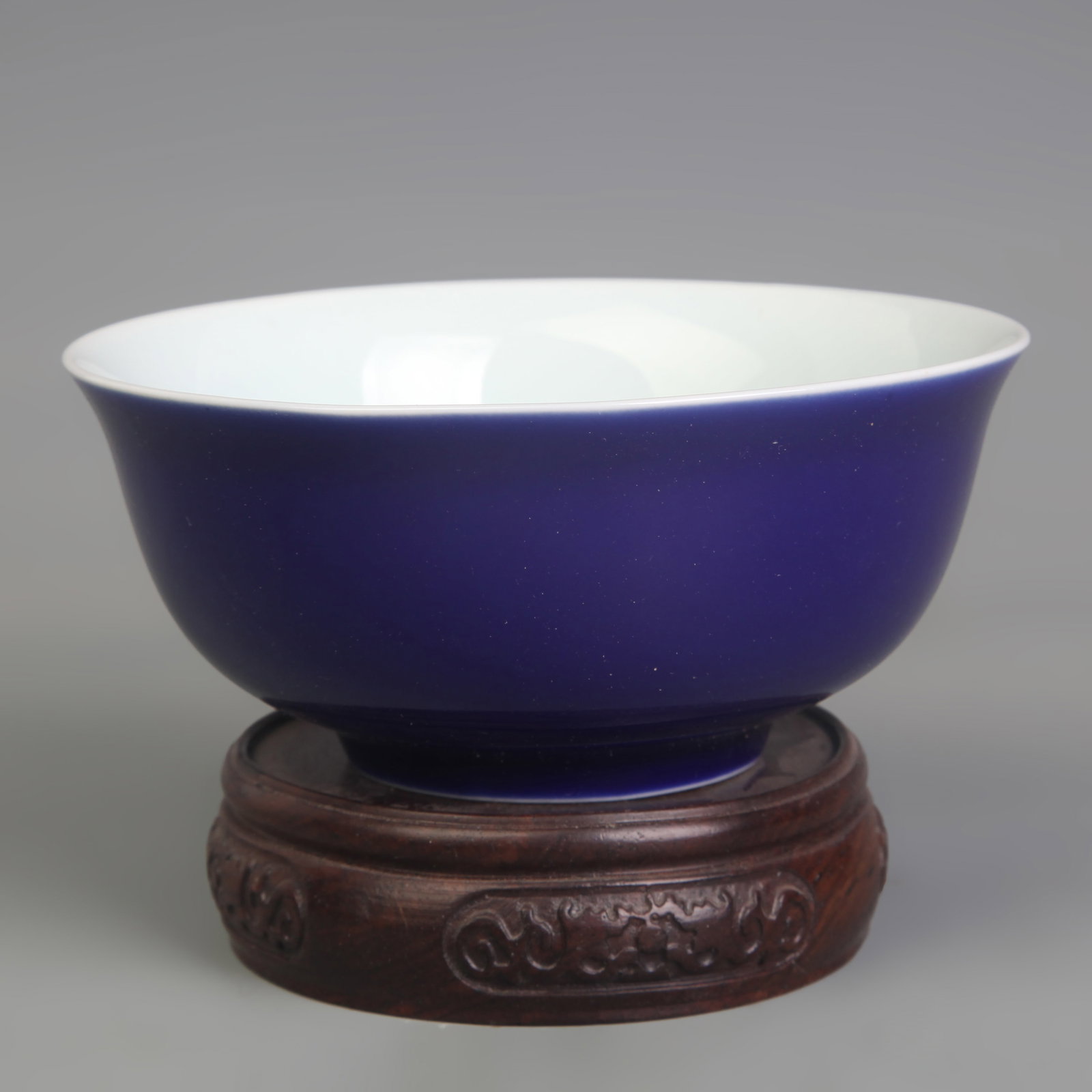 A FINE BLUE GROUND PORCELAIN BOWL: Qing Dynasty; Diameter: 5.3 inch; High: 2.3 inch; . Wooden base for display only