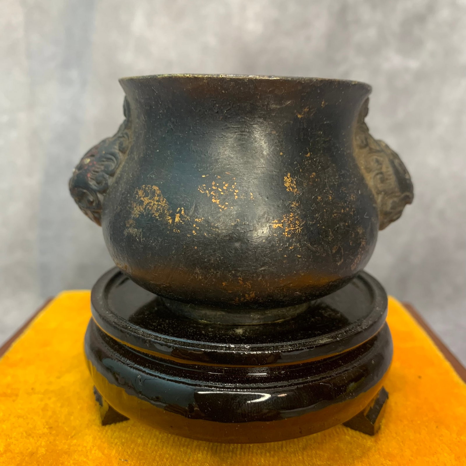 A FINE DOUBLE ANIMAL EAR SHAPED BRONZE CENSER: Qing Dynasty; High: 2.2 inch; Diameter: 2.7 inch. Wooden base for display only