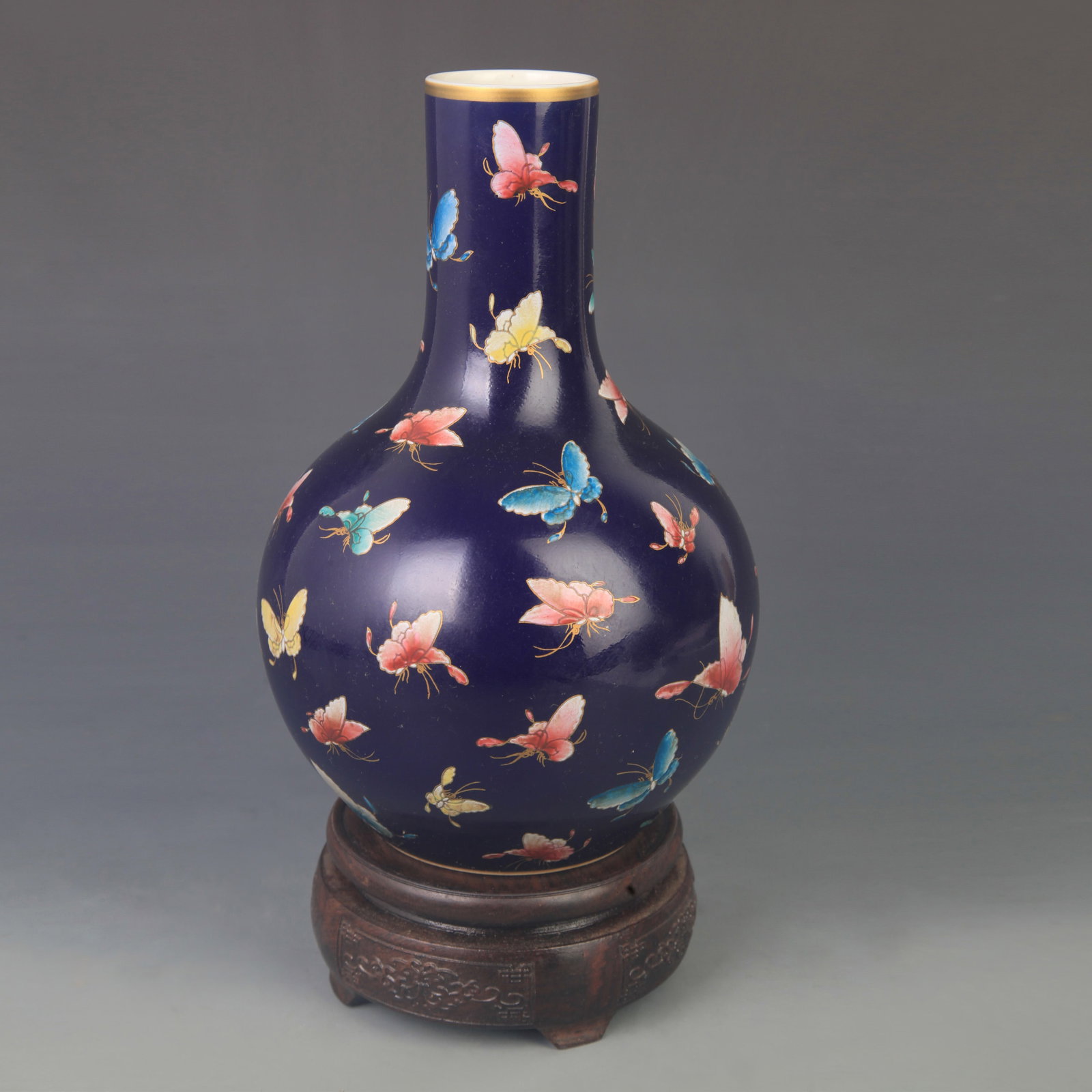 FAMILLE ROSE HUNDRED BUTTERFLY CELESTIAL GLOBE PORCELAIN VASE: Qing Dynasty Yongzheng Period; High: 9.50 inch; Diameter: 6.00 inch; . Wooden base for display only