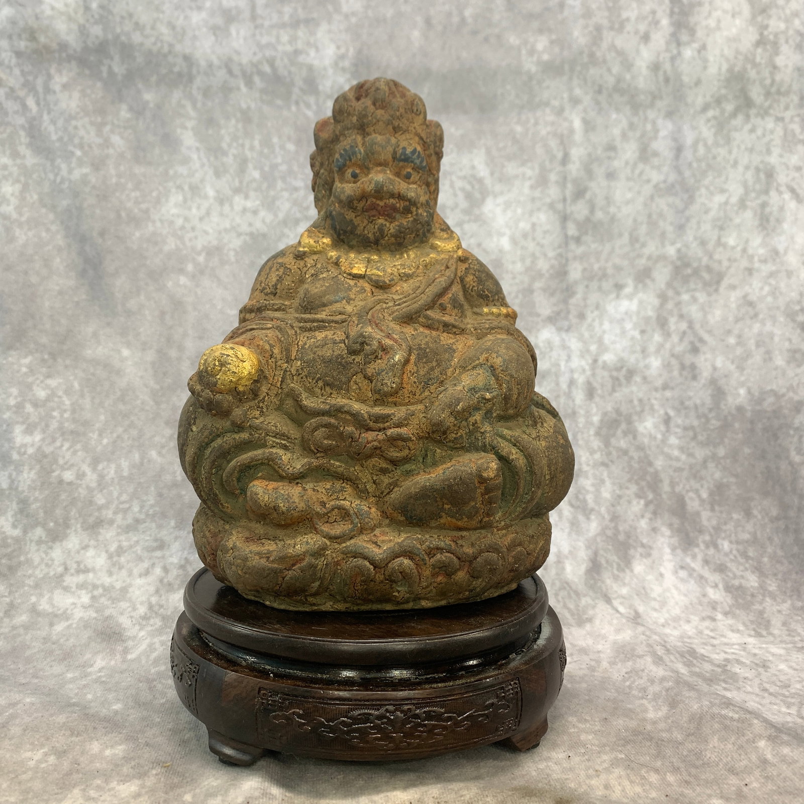LACQUERED AND WOOD STATUE OF JAMBHALA: Qing Dynasty; Long: 6.2 inch; Width: 4.8 inch; High: 8.6 inch; . Wooden base for display only