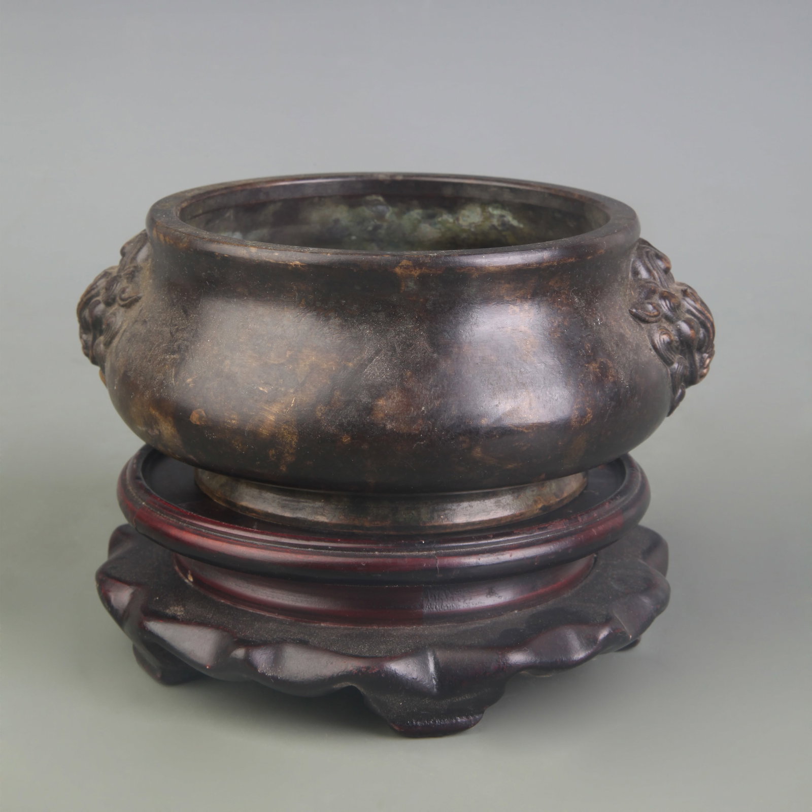 A FINE BEAST-EAR ROUND-FOOTED INCENSE BURNER: Ming Dynasty Xuande Period: Diameter: ; Diameter: 4.2 inch; High: 2.3 inch; . Wooden base for display only