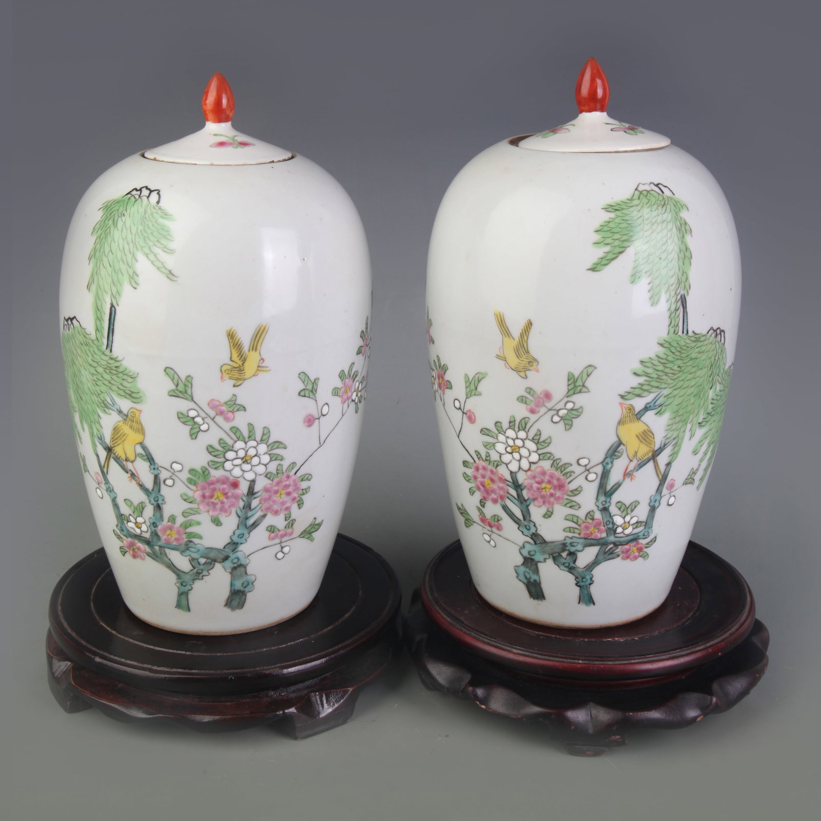 A PAIR OF FAMILLE ROSE WINTER MELON JARS WITH BIRD-AND-FLOWER DECORATION: Qing Dynasty; Diameter: 2.2 inch; High: 9.9 inch; . Wooden base for display only