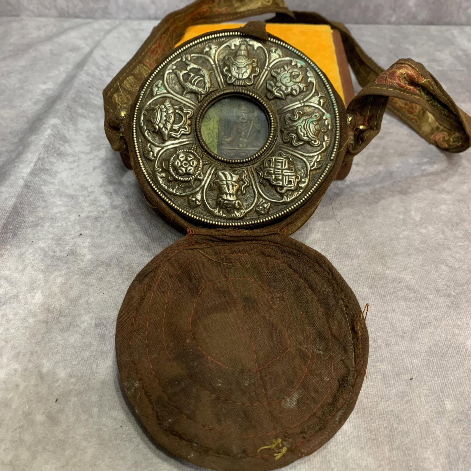 A FINE TIBETAN GAWU PENDANT: Republic Period; High: 4.7 inch; Width: 4.7 inch; Diameter: 1.8 inch . Wooden base for display only