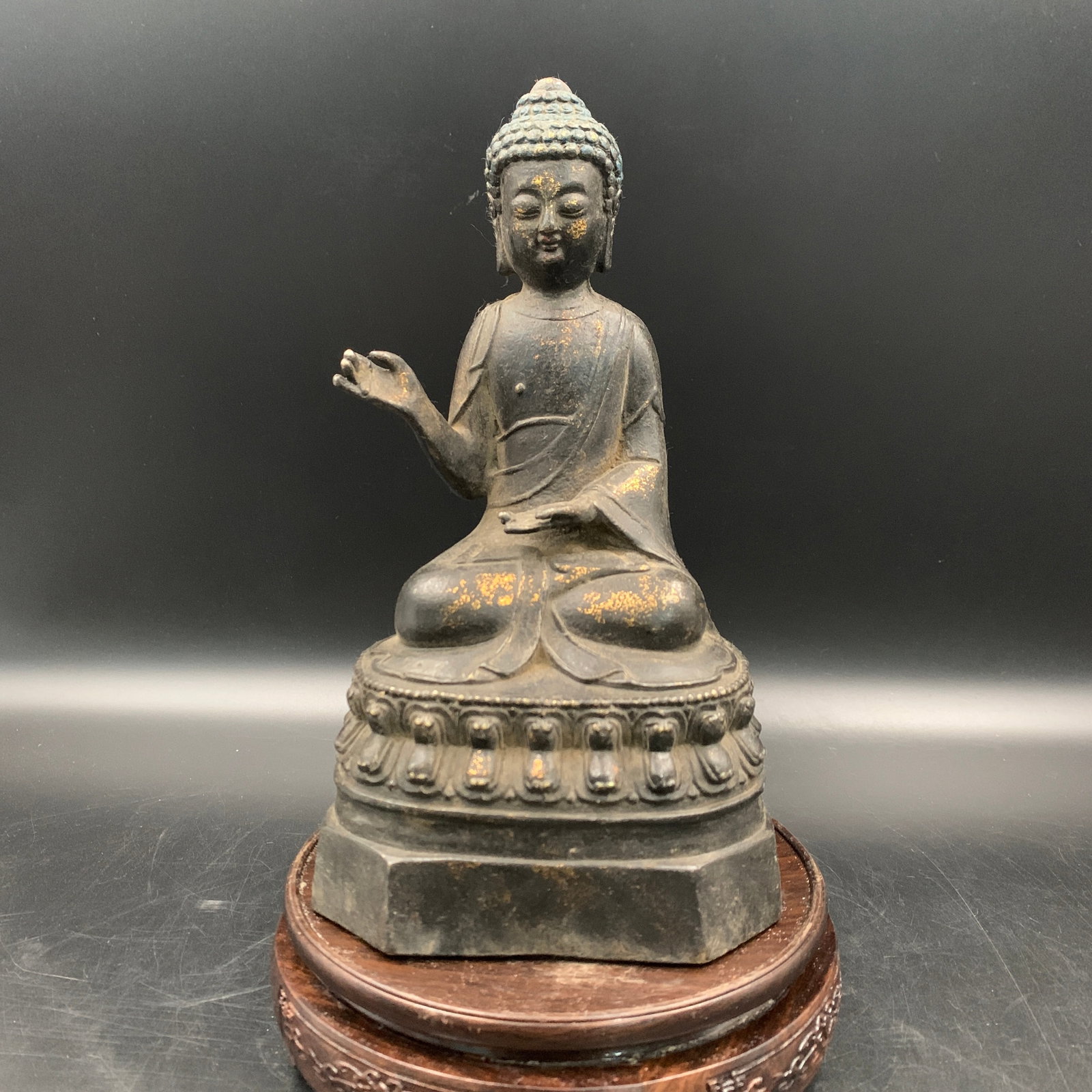GILT BRONZE SEATED BUDDHA MEDICINE KING: Qing Dynasty; Long: 5 inch; Width: 3.9 inch; High: 8.8 inch; . Wooden base for display only