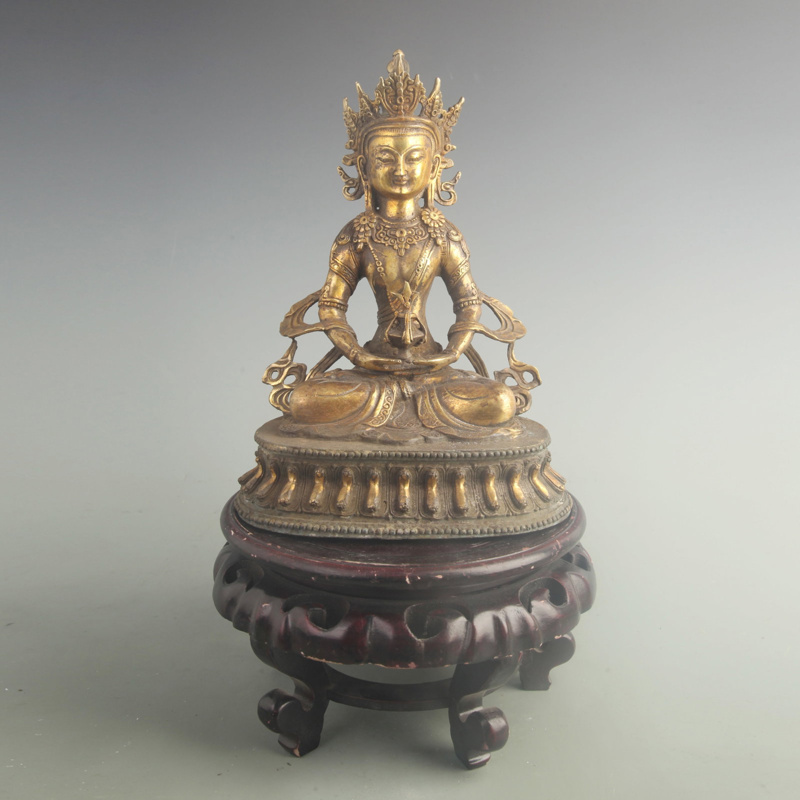 GILT-BRONZE STATUE OF AMITAYUS (THE BUDDHA OF INFINITE LIFE): 19th Century; High: 11.0 inch; Width: 7.50 inch; . Wooden base for display only