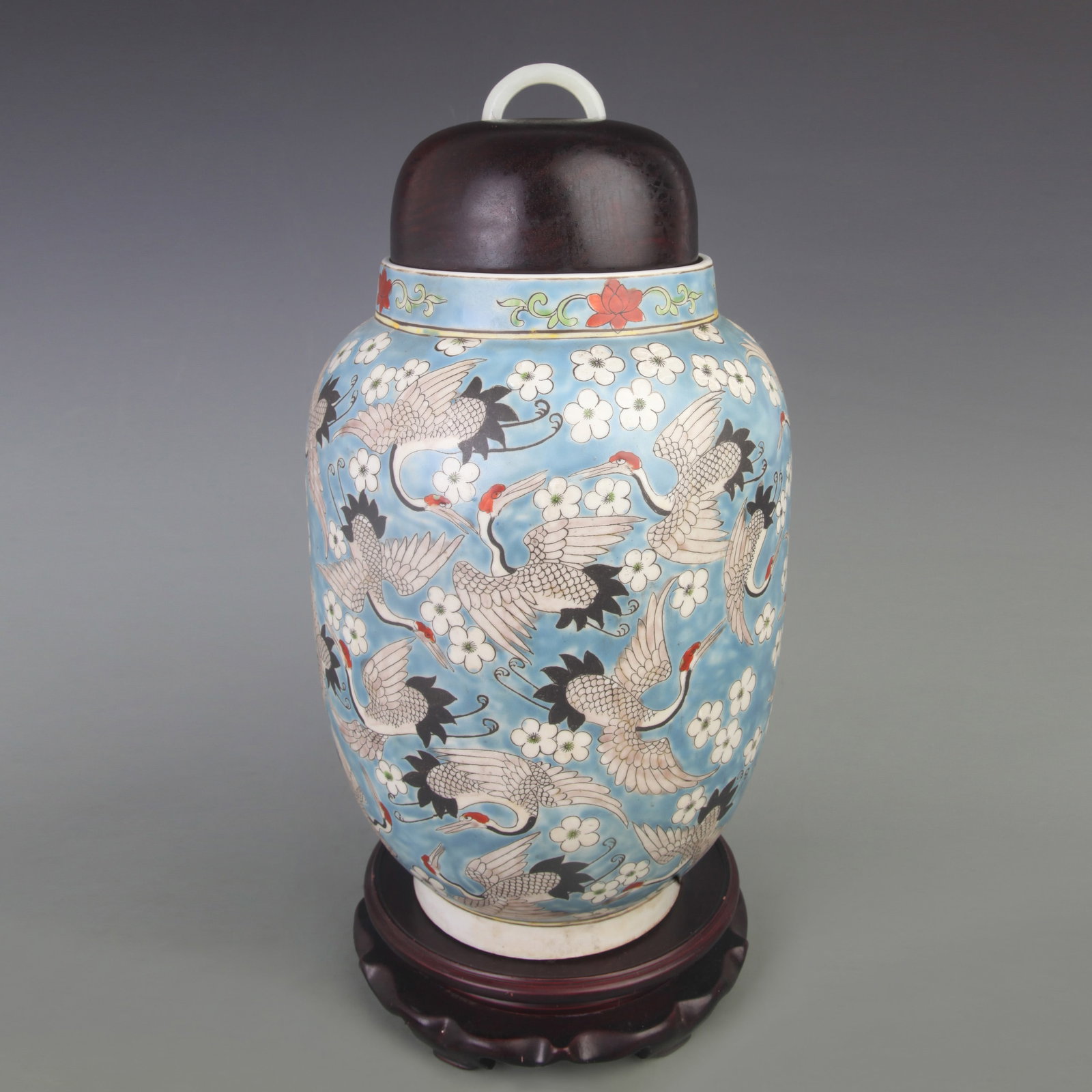 RARE BLUE-GROUND GENERAL JAR WITH BIRD AND FLOWER DECORATION (ROSEWOOD COVER AND WHITE JADE FINIAL): Qing Dynasty; Diameter: 7.5 inch; High: 15.0 inch; wooden base for picture and display purpose only.