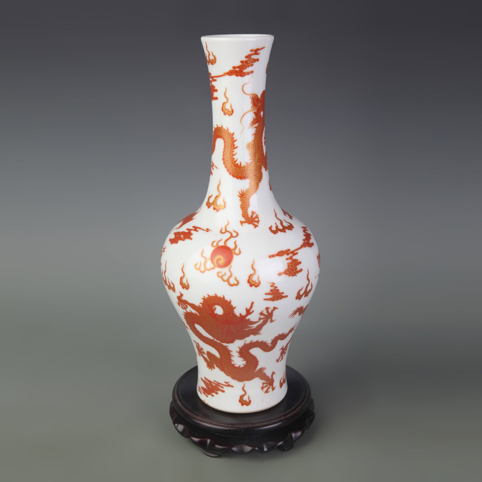 A FAMILLE ROSE RED-GROUND VASE WITH DRAGON MOTIF, YAOLING FORM: Qing Dynasty; Diameter: 2.2 inch; High: 12.0 inch; wooden base for picture and display purpose only.