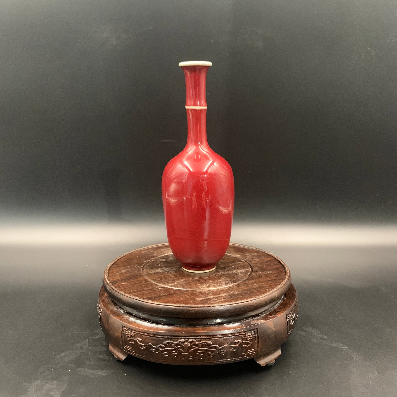 A PEACHBLOOM-GLAZED PORCELAIN VASE (LIU YE ZUN): Qing Dynasty; High: 6.7 inch; Diameter: 2.4 inch; wooden base for picture and display purpose only.