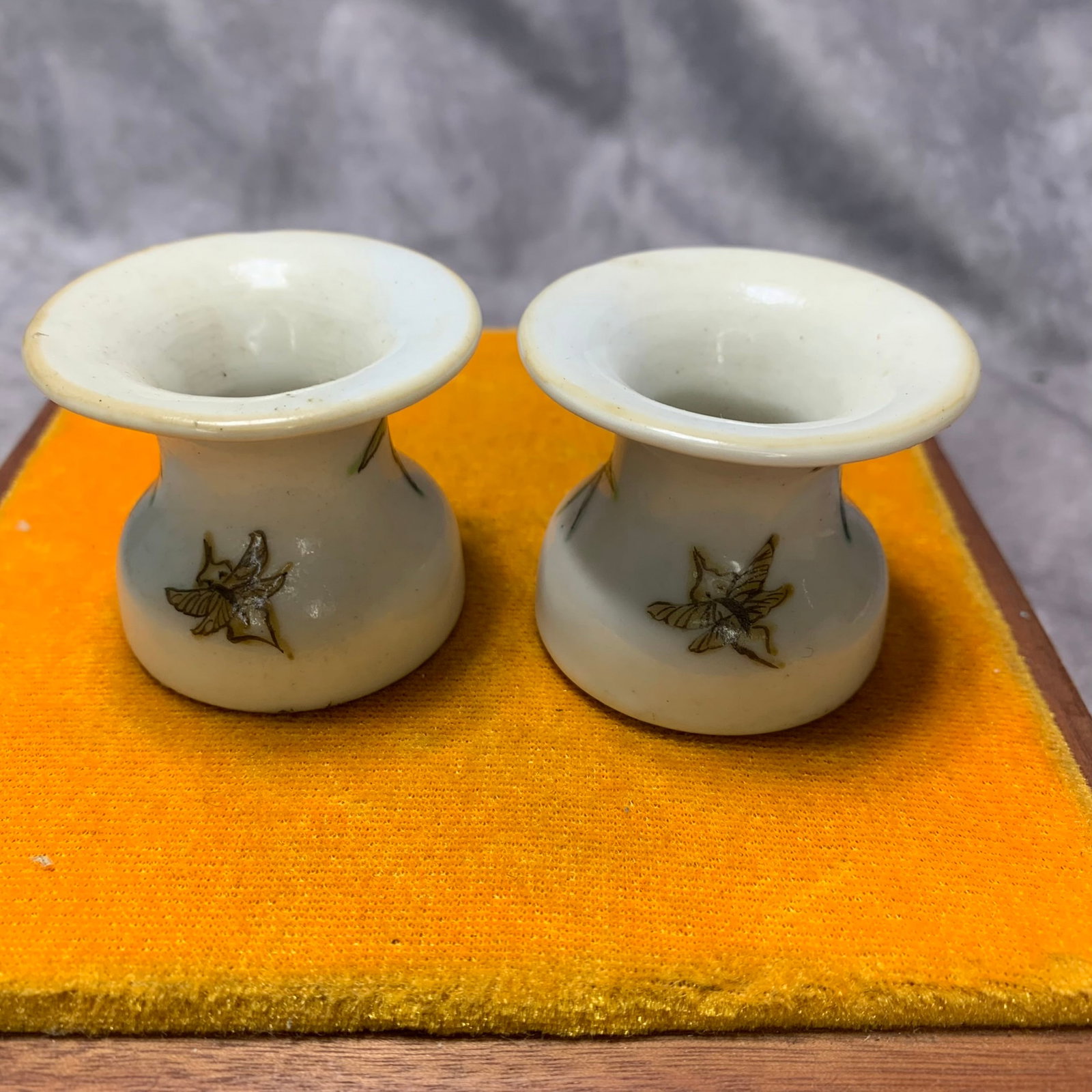 PAIR OF FAMILLE ROSE FLORAL PATTERN PORCELAIN WINE CUPS: Qing Dynasty; High: 1.7 inch; Diameter: 2 inch; wooden base for picture and display purpose only.