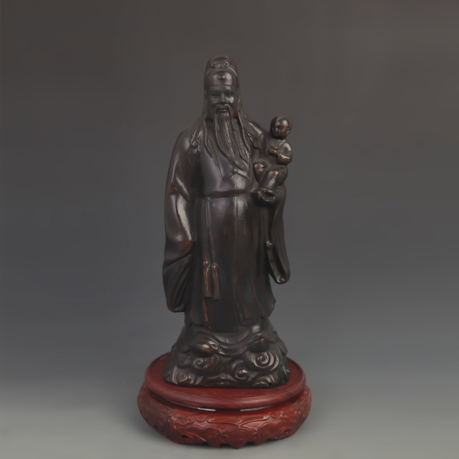 A FINE BAMBOO ROOT CARVING OF AUSPICIOUS FIGURES: 20th Century; High: 11.5 inch; Width: 4.25 inch; wooden base for picture and display purpose only.