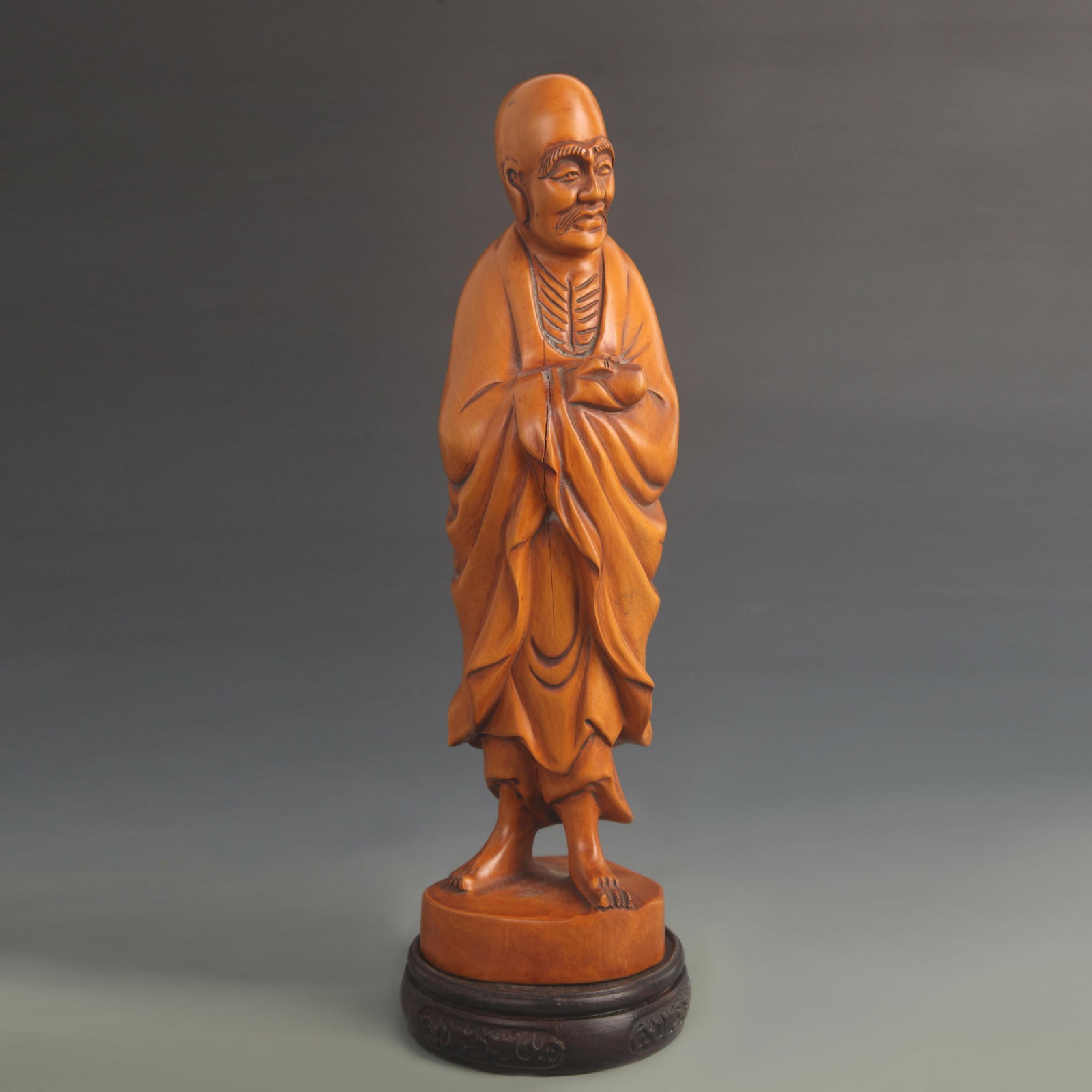 A FINE BOXWOOD CARVED STANDING ARHAT FIGURE: 20th Century; High: 12.50 inch; Width: 3.50 inch; wooden base for picture and display purpose only.