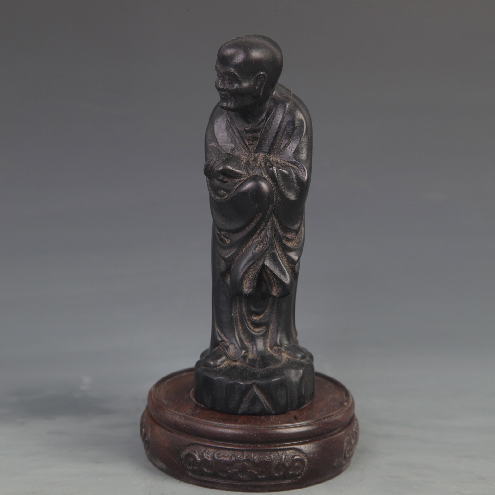 A BOXWOOD CARVED ARHAT FIGURE: 20th Century; High: 6.25 inch; Width: 1.75 inch; wooden base for picture and display purpose only.