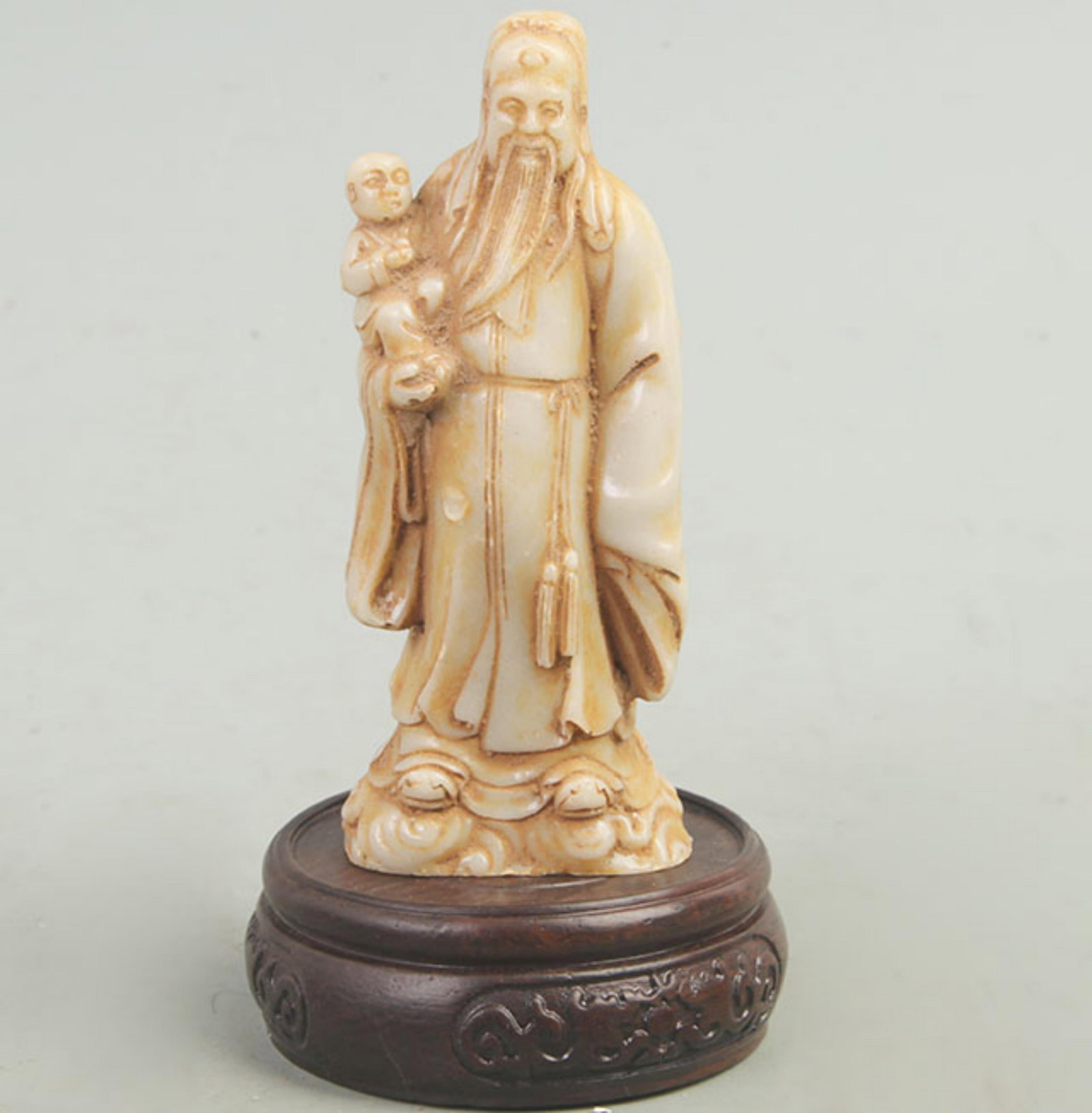 A FINE GLASS LIU LI IMMORTAL FIGURE: 20th Century; High: 4.6 inch; Width: 1.6 inch; Long: 1.8 inch; wooden base for picture and display purpose only.