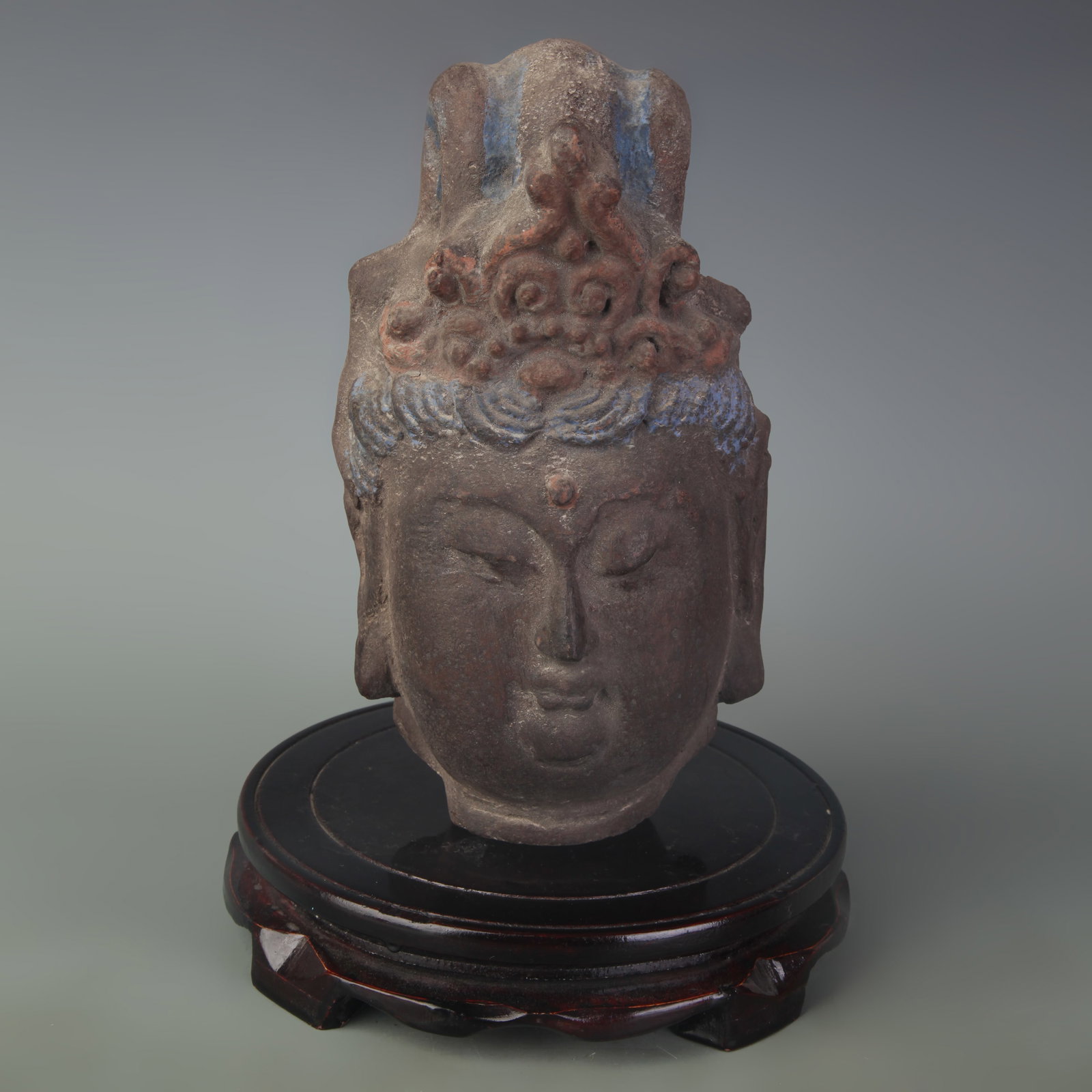 A CHINESE PAINTED POTTERY HEAD OF GUANYIN BODHISATTVA: Ming Dynasty; Width: 4.8 inch; High: 8.1 inch; wooden base for picture and display purpose only.