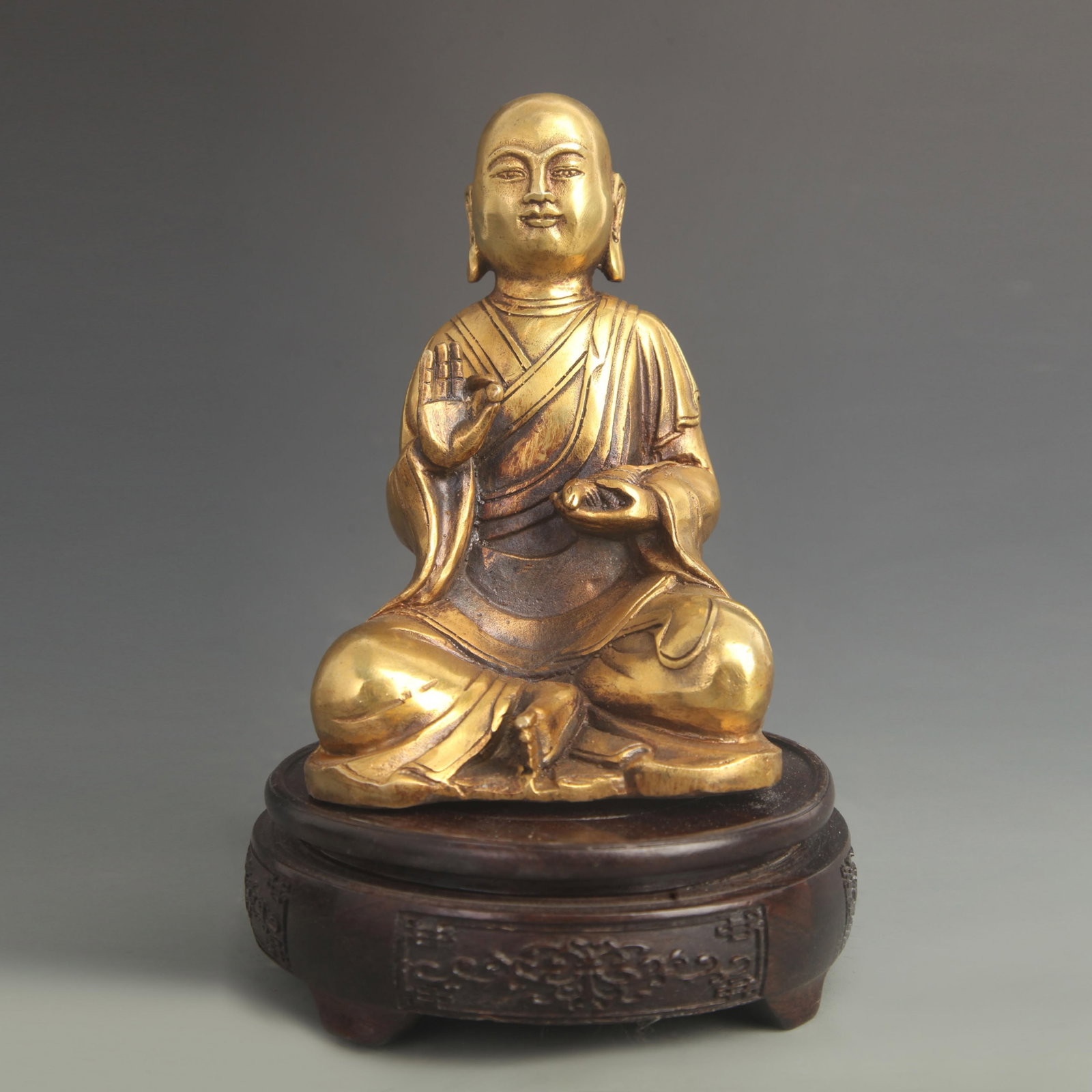 A FINE TIBETAN BRONZE YELLOW DZAMBHALA STATUE: 20th Century; High: 6.50 inch; Width: 4.00 inch; wooden base for picture and display purpose only.
