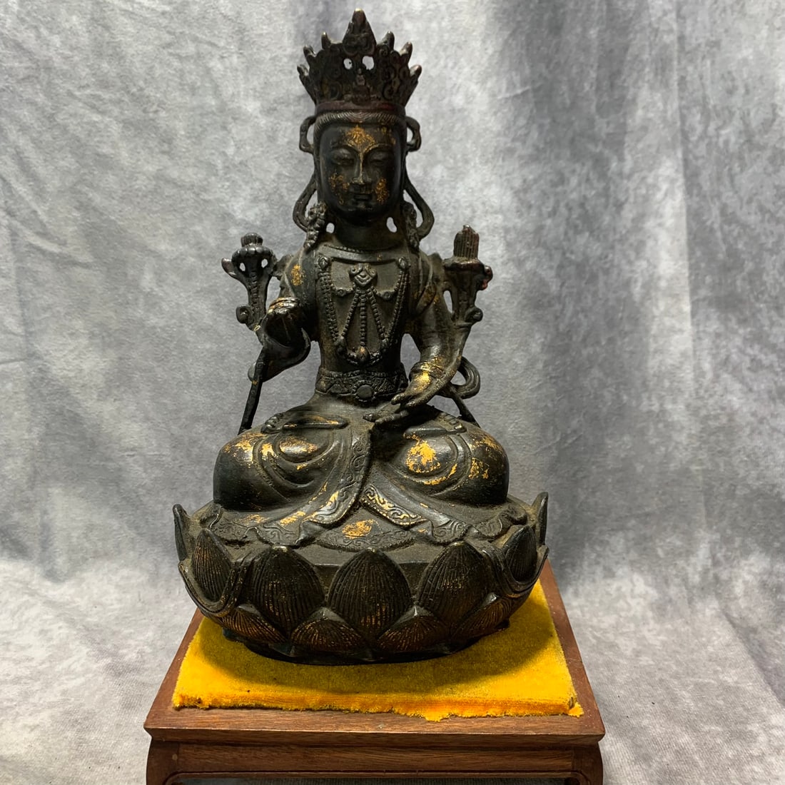 A GILT-BRONZE FIGURE OF A BODHISATTVA: Qing Dynasty; Long: 5.8 inch; Width: 4.3 inch; High: 9.5 inch; wooden base for picture and display purpose only.