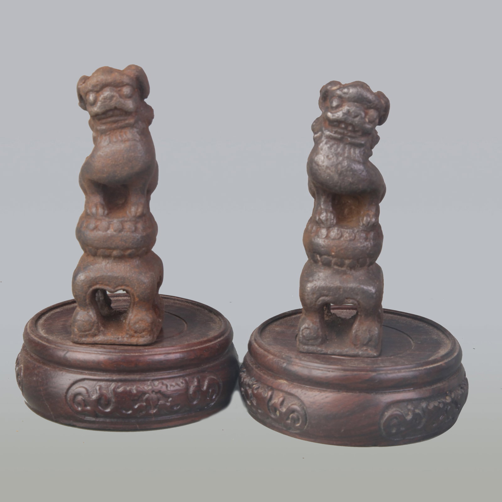 PAIR OF SMALL CAST IRON LION FIGURINES: Qing Dynasty; High: 3.7 inch; wooden base for picture and display purpose only.
