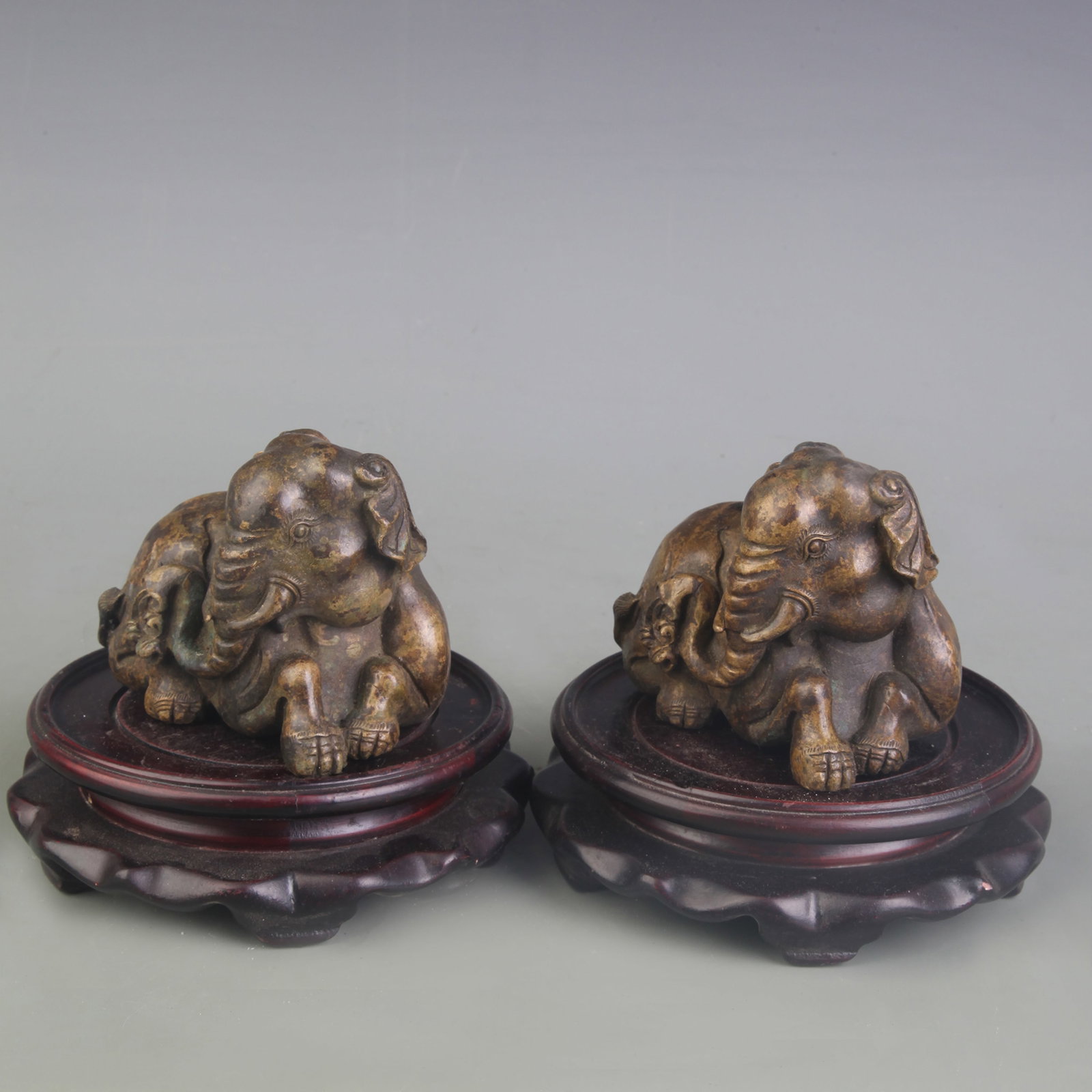 PAIR OF BRONZE ANIMAL-FORM ORNAMENTS: Qing Dynasty; Long: 3.7 inch; High:2.9 inch; wooden base for picture and display purpose only.